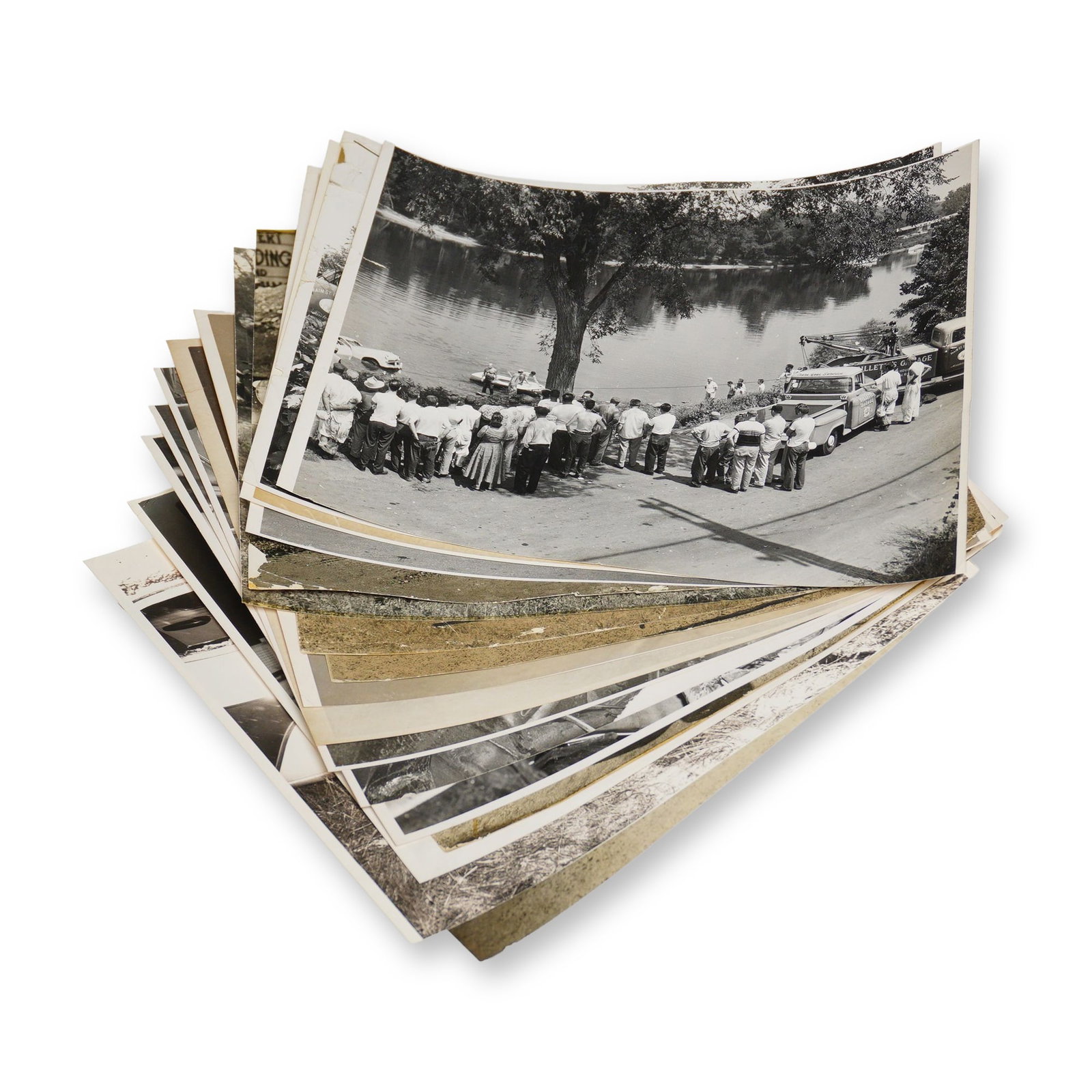 Collection of Twenty Accident Scene Photographs c. 1950-1960s: Twenty on-scene photos taken at accident sites with accident details on reverse of some. Dimensions: 10"L x 7.5"H Weight: 6.9 oz.