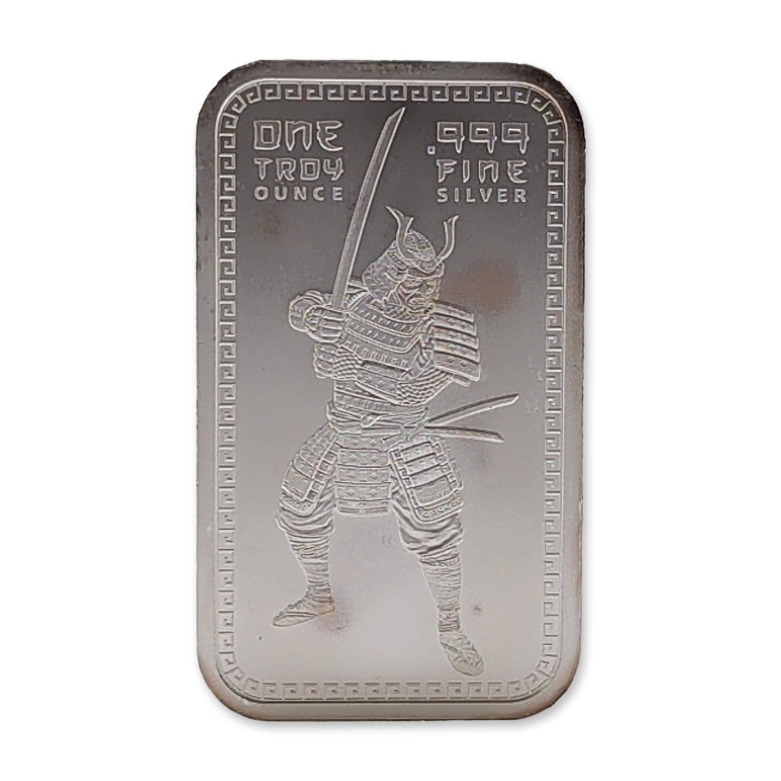 Samurai Warrior .999 Fine Silver Bullion Bar: Silver bullion bar in .999 fine silver featuring a samurai warrior motif. The obverse depicts an embossed figure of a samurai in traditional yoroi armor and kabuto helmet holding a katana. Inscription