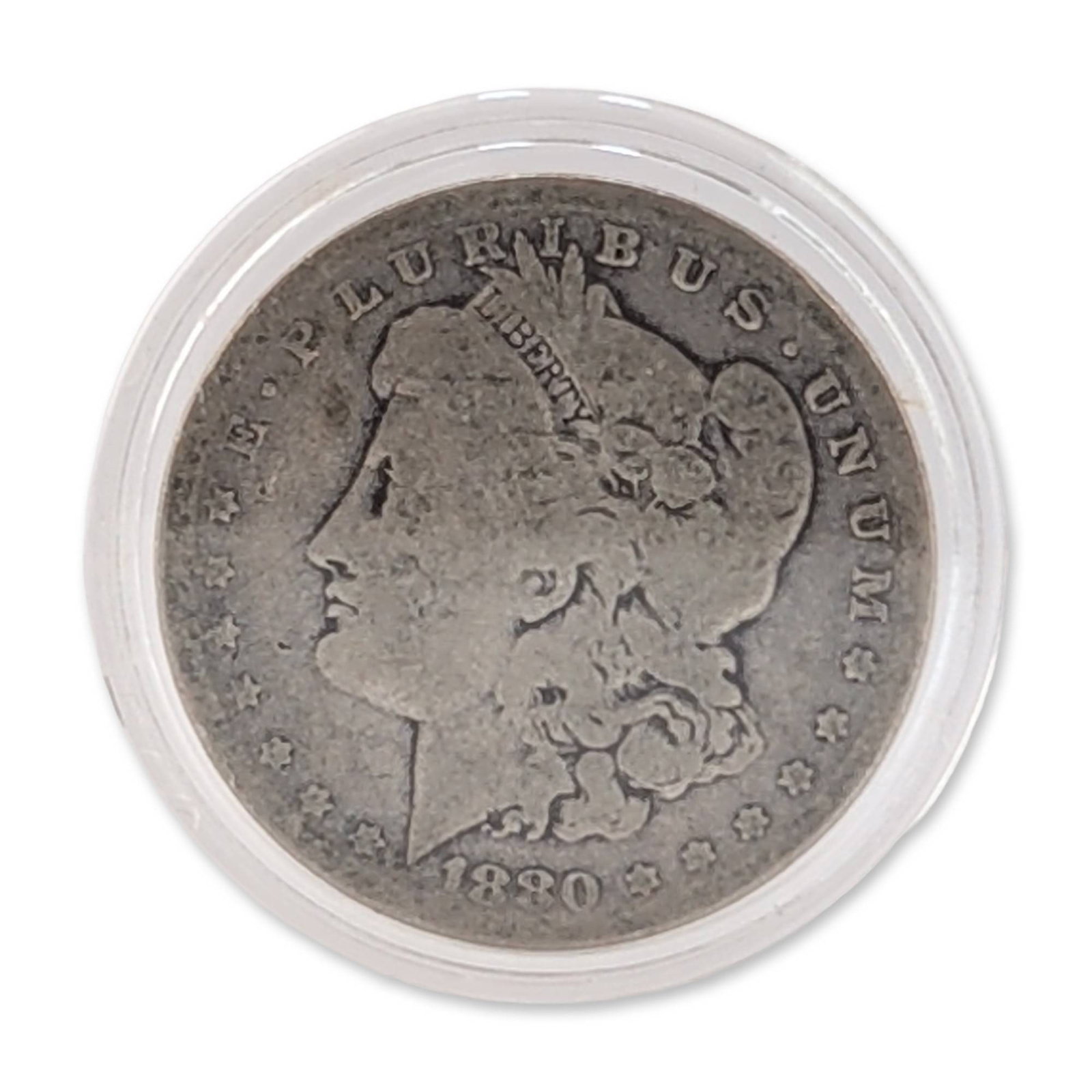 1880 US Morgan Silver Dollar: 1880 US Morgan silver dollar struck in .900 fine silver. The obverse features the George T. Morgan design of Lady Liberty, while the reverse depicts an eagle clutching arrows and an olive branch withi