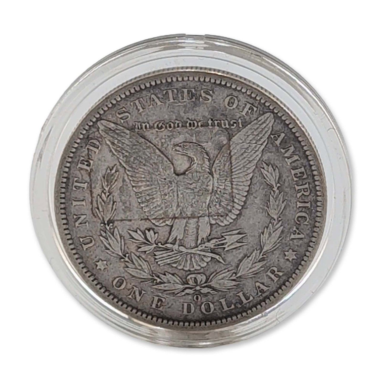 1887 US Morgan Silver Dollar: 1887 US Morgan silver dollar struck at the Philadelphia mint. Metal composition of .900 silver and .100 copper. Housed in a clear plastic protective capsule. Dimensions: Coin only: 38.1 mm. Weight: Co