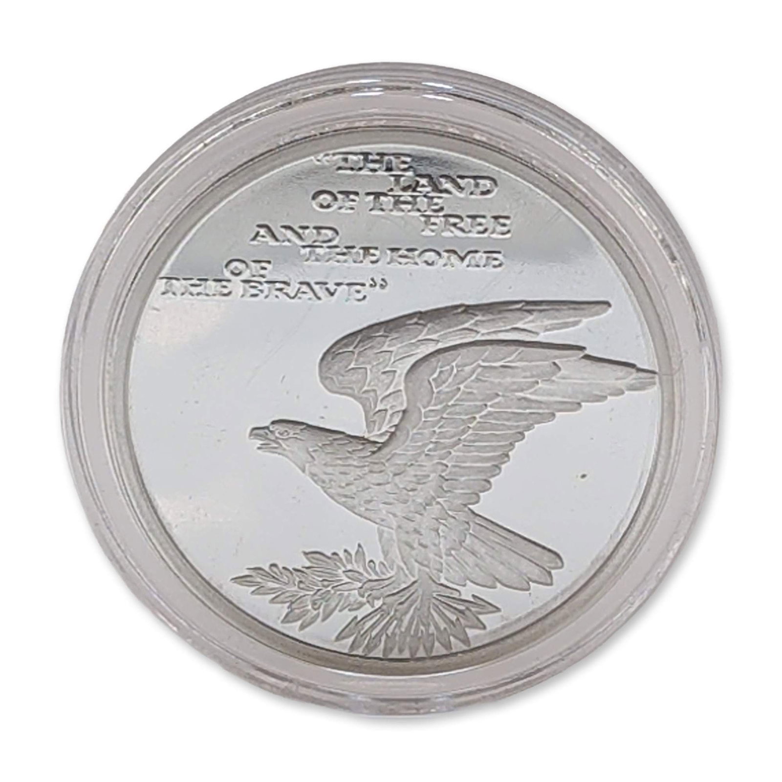 US Bicentennial Star Spangled Banner Silver Dollar: Commemorative silver medal celebrating the bicentennial of the US national anthem. Obverse features a flag design with fifteen stars and transcribed inscriptions "OUR FLAG WAS STILL THERE" and ".1814-