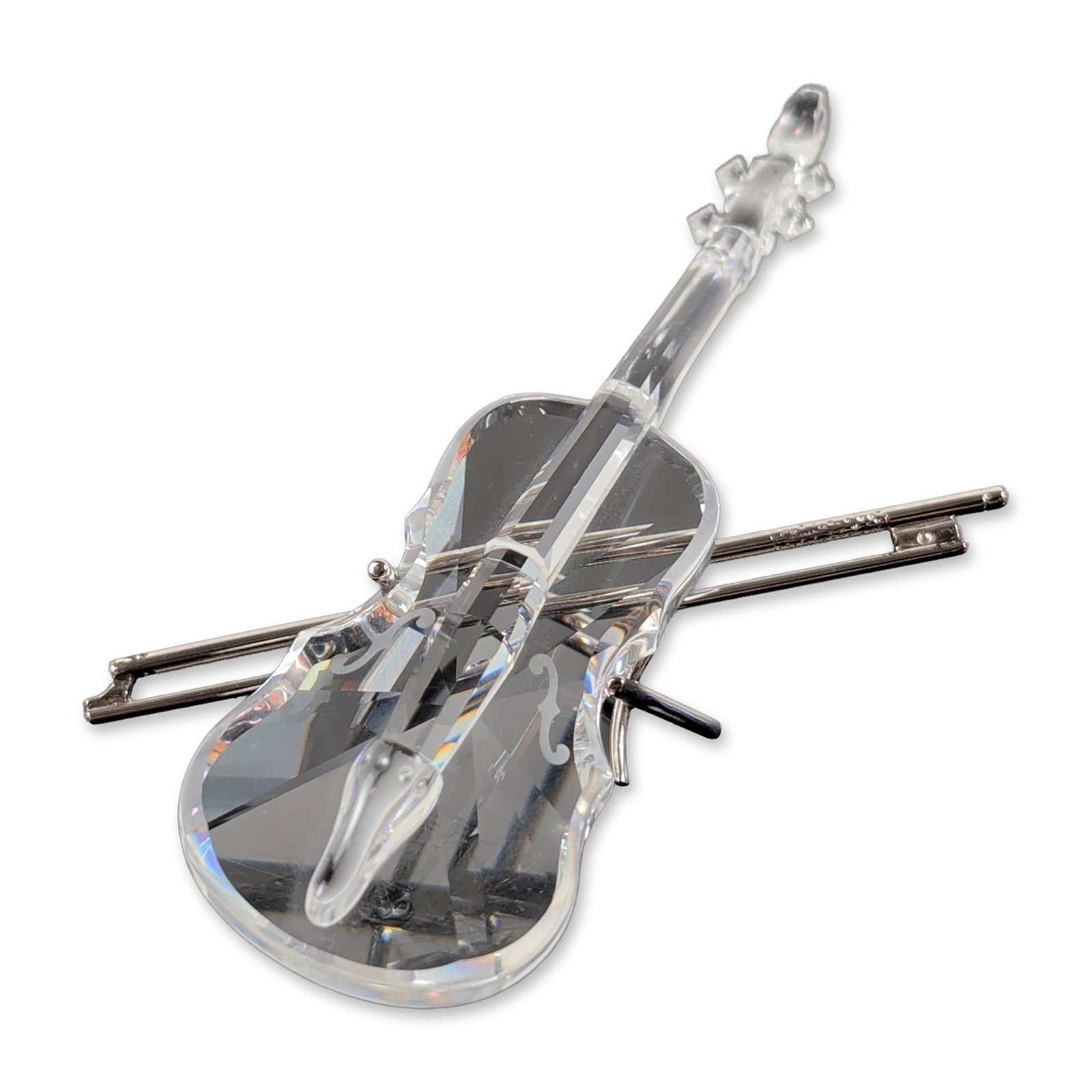 Swarovski Silver Crystal Violin with Bow and Stand: Swarovski Silver Crystal miniature violin with bow and display stand. Crafted from clear faceted crystal with rhodium-plated metal components for the bow and stand. Features an acid-etched Swarovski s