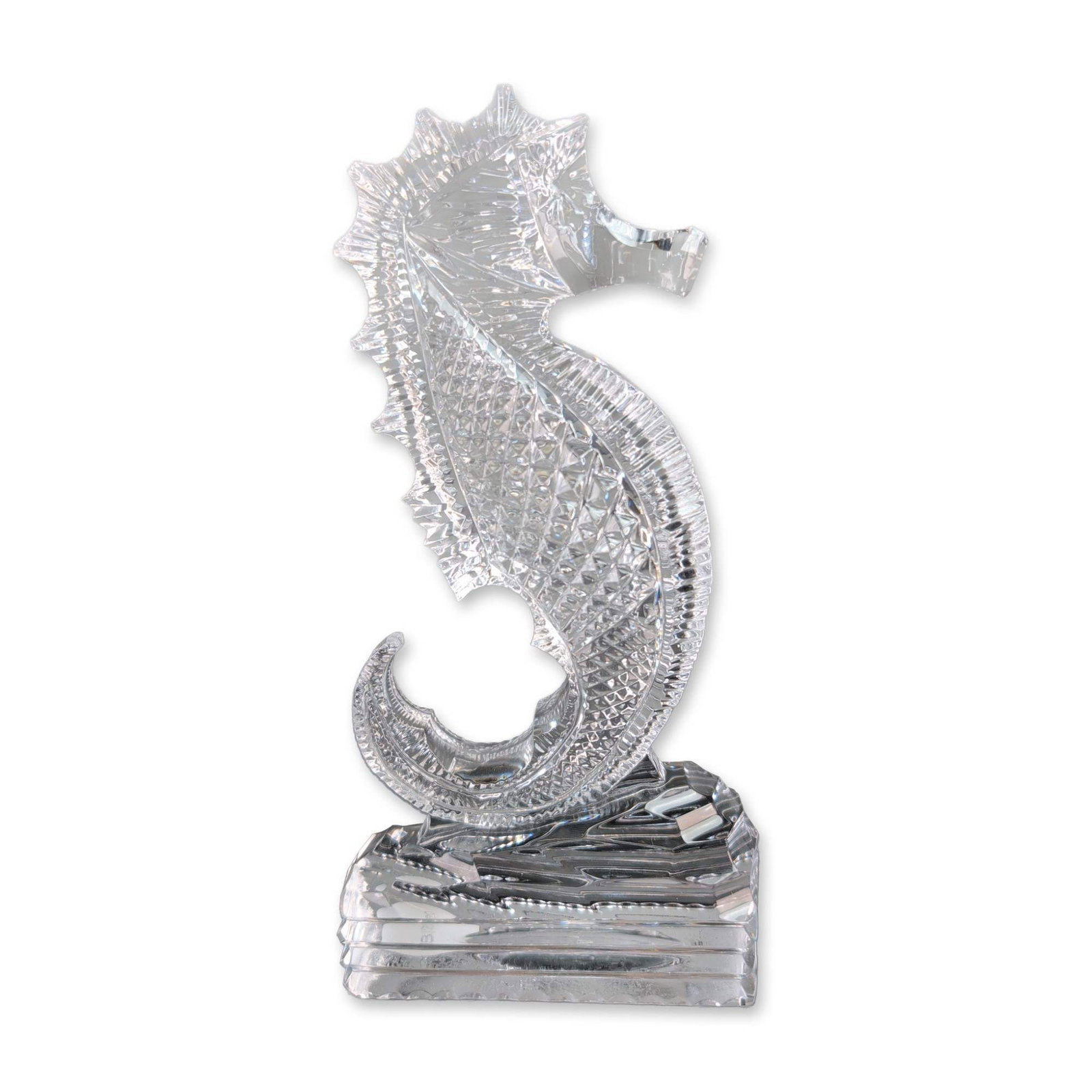 Waterford Crystal Seahorse Figurine: Waterford Crystal seahorse figurine in clear cut lead crystal, featuring a stylized form with diamond and wedge cuts. The figurine is mounted on a rectangular crystal base with vertical facet cuts. Ac