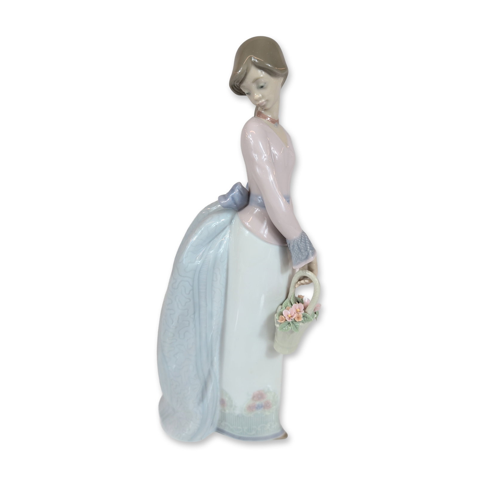 Lladro Basket of Love Porcelain Figurine 7622: Lladro (Spanish, 20th century). Glazed porcelain figurine titled Basket of Love, model number 7622. The figurine depicts a young woman in a pink bodice and light blue patterned apron holding a white b