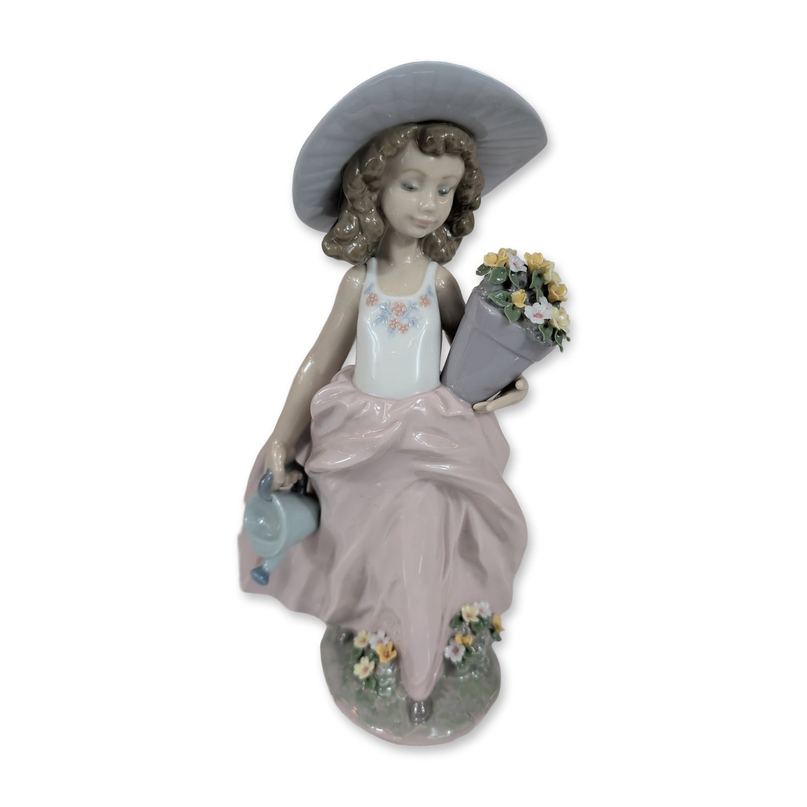 Lladro A Wish Come True Porcelain Figurine 7676: Lladro Spanish glazed porcelain figurine titled A Wish Come True, model number 7676. This 1999 Collectors Society piece depicts a young girl wearing a wide-brimmed blue sunhat and a flowing mauve-colo