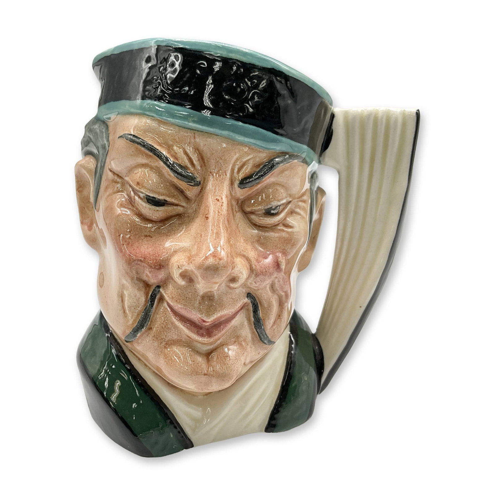 Mikado D6507 - Small - Royal Doulton Character Jug: Black and turquoise hat; green and white robes. Royal Doulton backstamp. Artist: Max Henk Dimensions: 3.75"H Date or Era: 1959 - 1969 Manufacturer or Brand: Royal Doulton Country of Origin: E