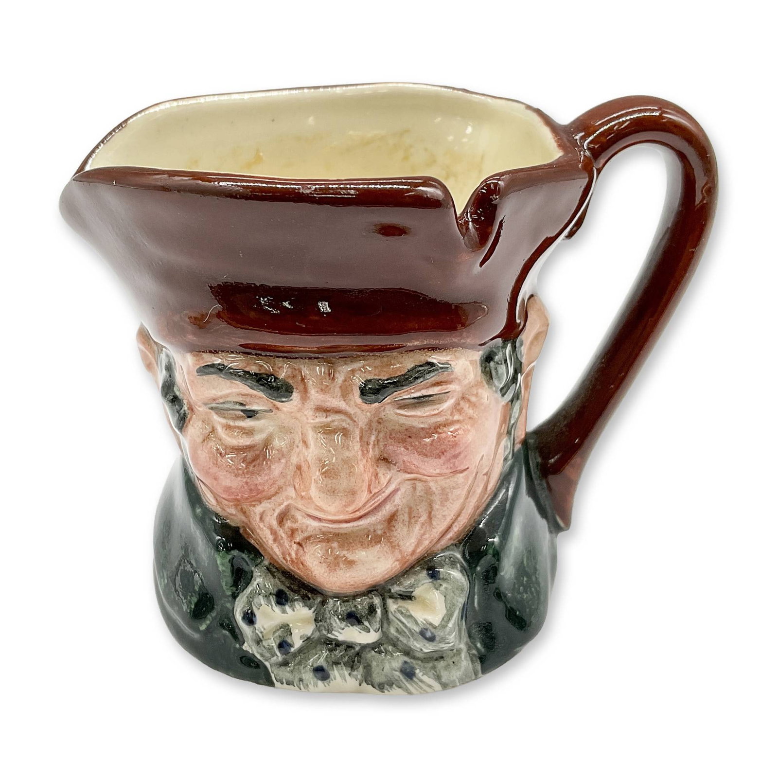 Old Charley D6046 - Mini - Royal Doulton Character Jug: Brown hat; dark green coat; blue polka-dot bow tie. Royal Doulton backstamp. Artist: Charles J. Noke Dimensions: 2.25"H Date or Era: 1939 - 1983 Manufacturer or Brand: Royal Doulton Country of Ori