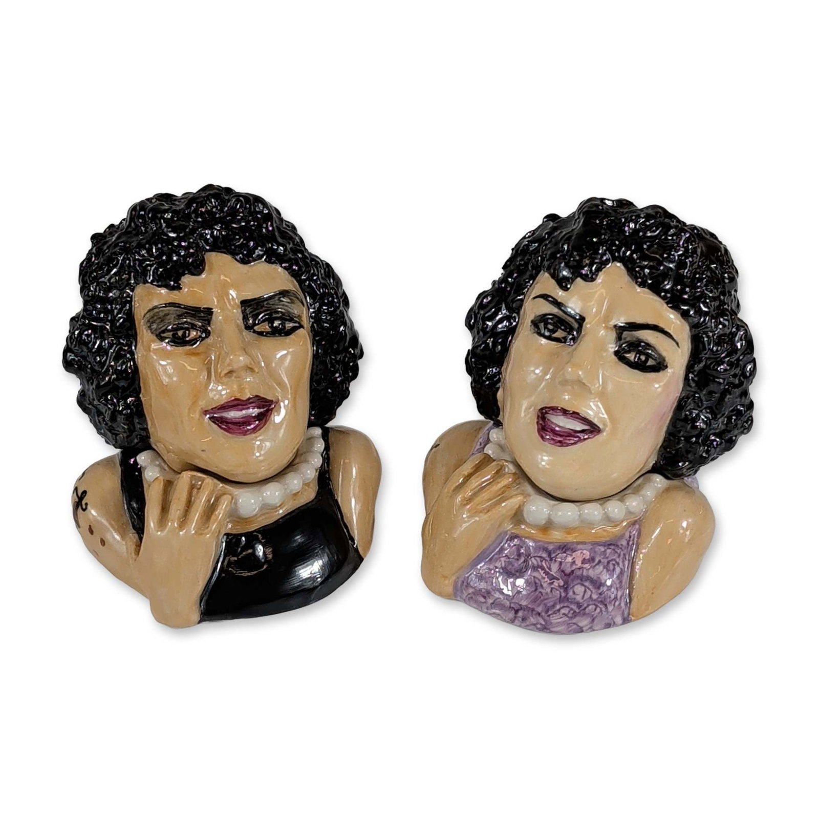 Pair of Kevin Francis The Rocky Horror Picture Show Face Pots: Kevin Francis Ceramics. Pair of glazed ceramic face pots depicting the character Dr. Frank-N-Furter from the film The Rocky Horror Picture Show. Hand-painted figures include one version in a purple co