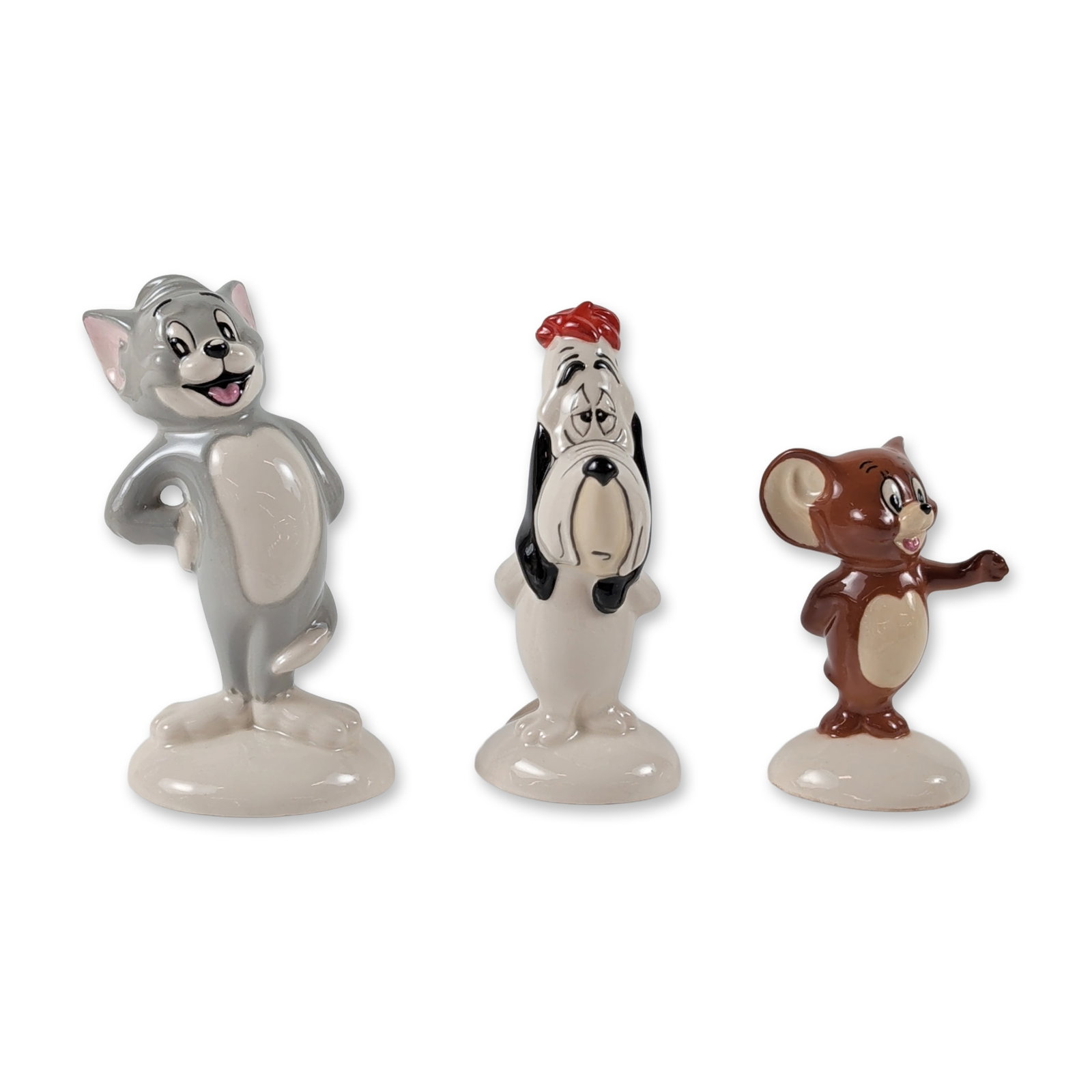3pc John Beswick Tom Jerry and Droopy Figurines: John Beswick for Royal Doulton, 1995. Trio of hand-painted, glazed porcelain figurines depicting MGM cartoon characters Tom, Jerry, and Droopy. The figures are modeled in classic character poses with 