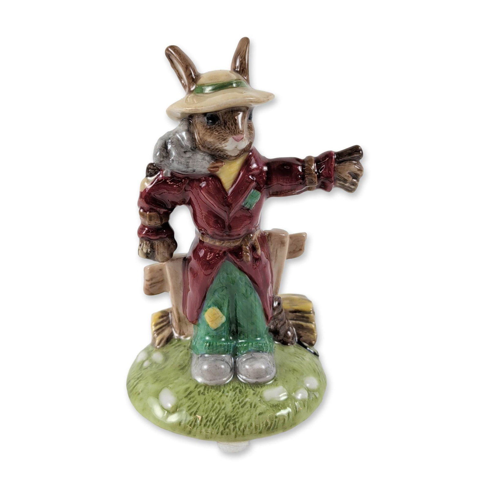 Royal Doulton Scarecrow Bunnykins Ceramic Figurine: Royal Doulton Scarecrow Bunnykins figurine, model DB 359 A, in glazed ceramic. The figure depicts a rabbit character dressed as a scarecrow with outstretched arms, wearing a wide-brimmed straw hat, ma
