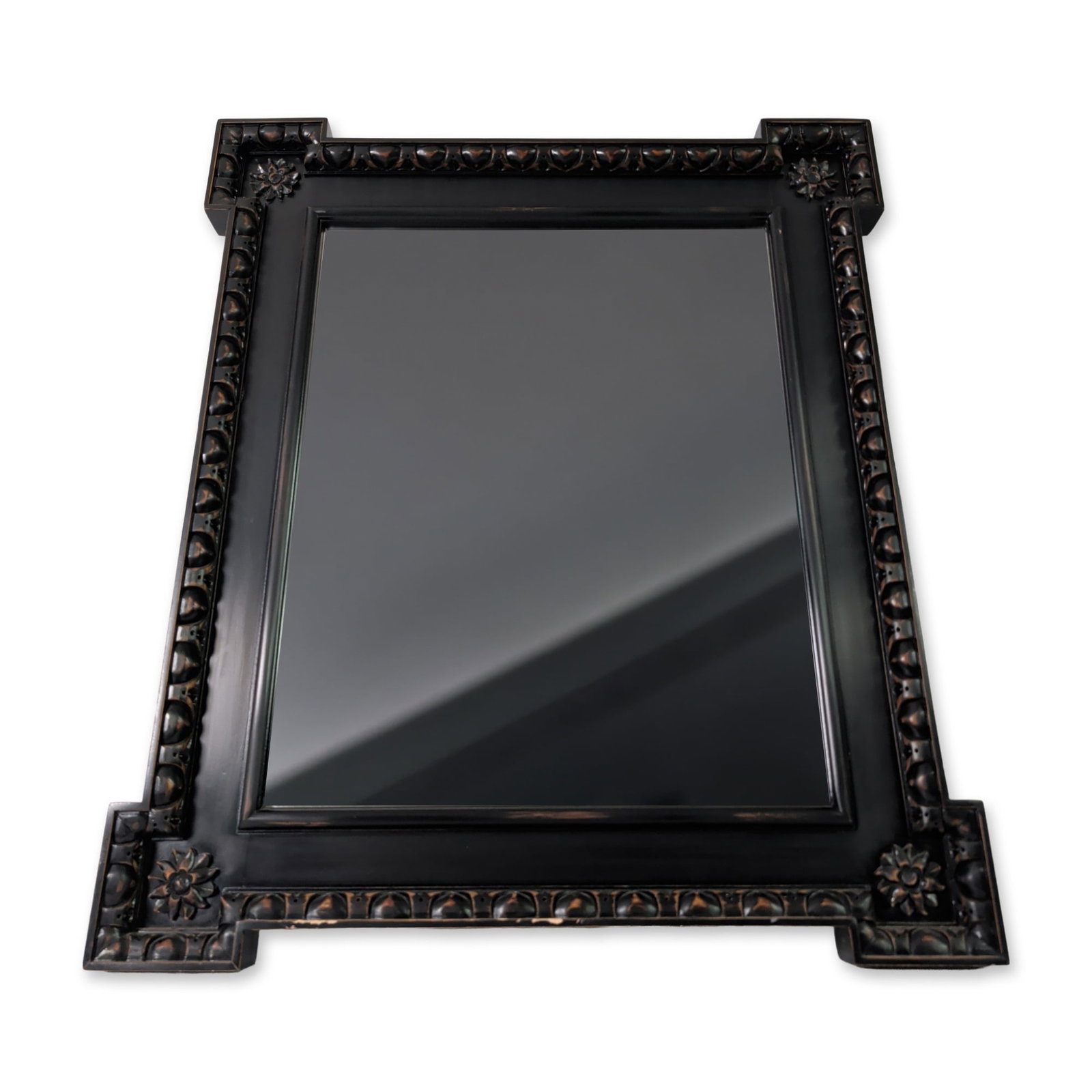 Romanian Black Painted Wood Wall Mirror: Contemporary Romanian neoclassical style wall mirror in a blocked-corner wood frame. The frame features gadrooned molding and relief-carved floral rosettes at each corner block. Finished in a matte