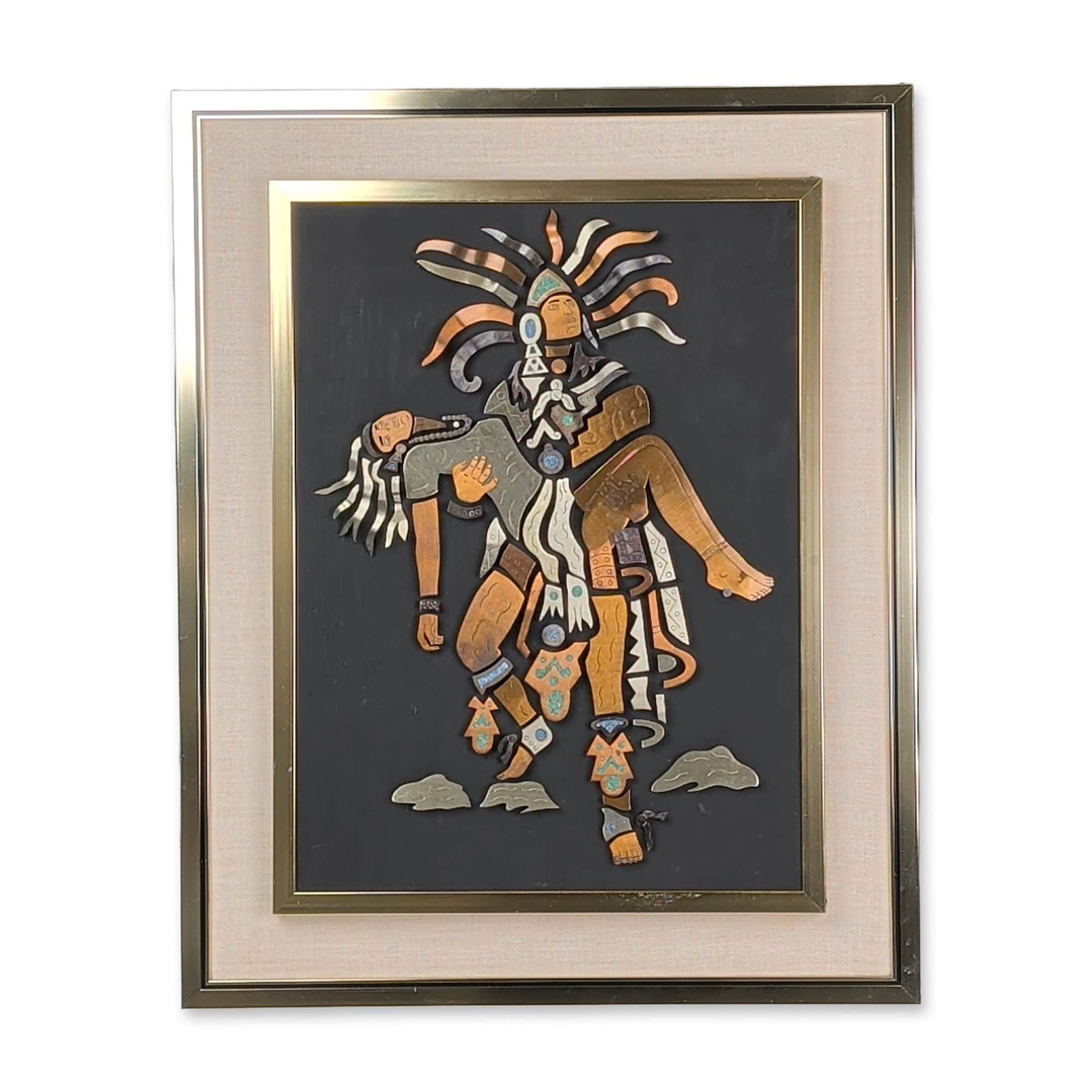 Los Castillo Style Mexican Mixed Metal Aztec Motif Wall Plaque: Mexican mid-century modern wall plaque featuring a stylized Mesoamerican figure in mixed metal and stone inlay. The raised fragmented composition consists of copper, brass, and silver-toned metal