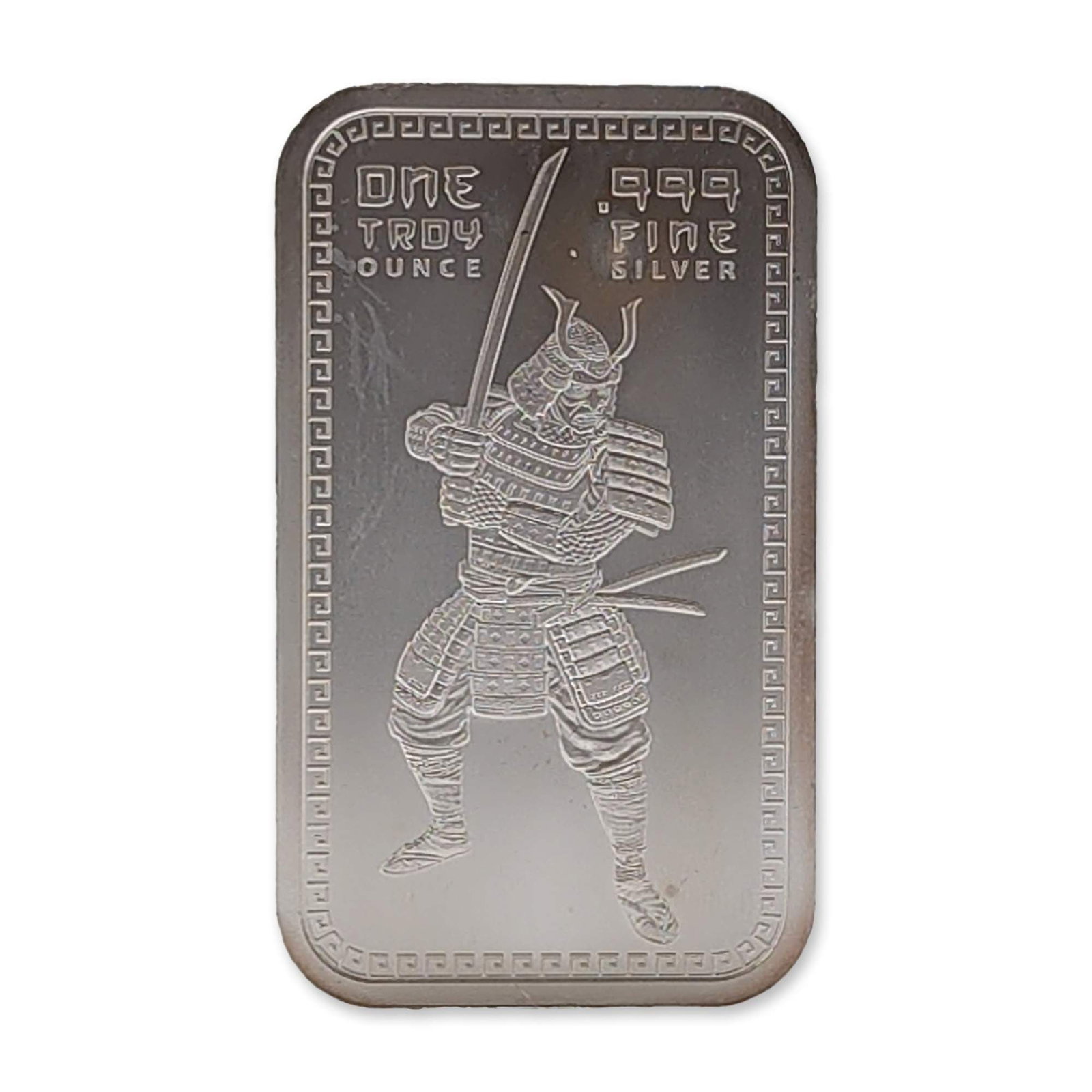 Samurai Warrior 1 oz .999 Fine Silver Bullion Bar: Samurai warrior design silver bullion bar in .999 fine silver. The obverse features a samurai warrior in traditional armor with a katana. Inscribed .999 FINE SILVER and ONE TROY OUNCE. The reverse dis
