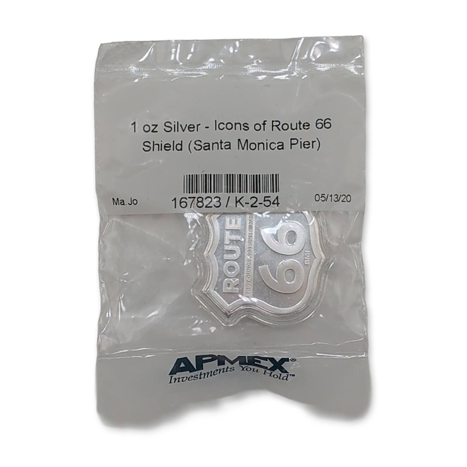 1 oz t .999 Fine Silver Route 66 Santa Monica Shield: APMEX Icons of Route 66 series Santa Monica Pier edition bullion shield. 2020 S.M.I Mint APMEX. Struck in .999 fine silver, the piece is shaped as a highway shield. The obverse features the word