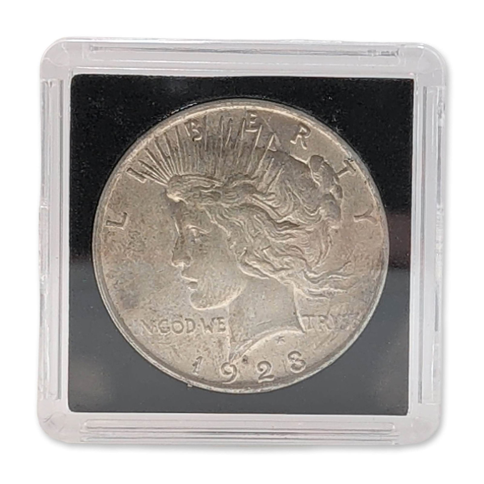 1923 US Peace Silver Dollar Unc: 1923 US Peace silver dollar Uncirculated. Features the radiate crown Liberty obverse and perched eagle reverse. This issue represents the lowest mintage of the Peace dollar series. Housed in a square 