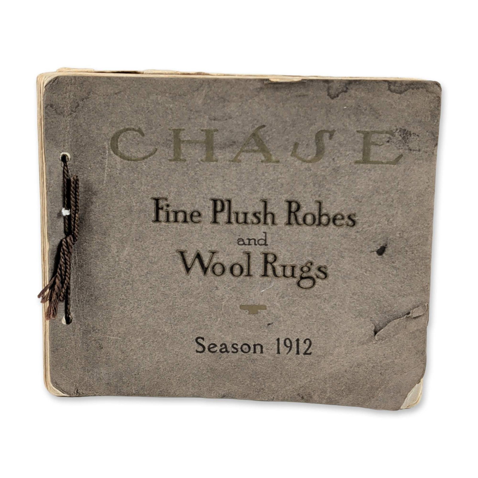 1912 L.C. Chase & Co. Plush Robes Trade Catalog: L.C. Chase & Co. trade catalog for the 1912 season, featuring Fine Plush Robes and Wool Rugs. Small-format publication with heavy gray cardstock covers and embossed lettering. The interior contains mu