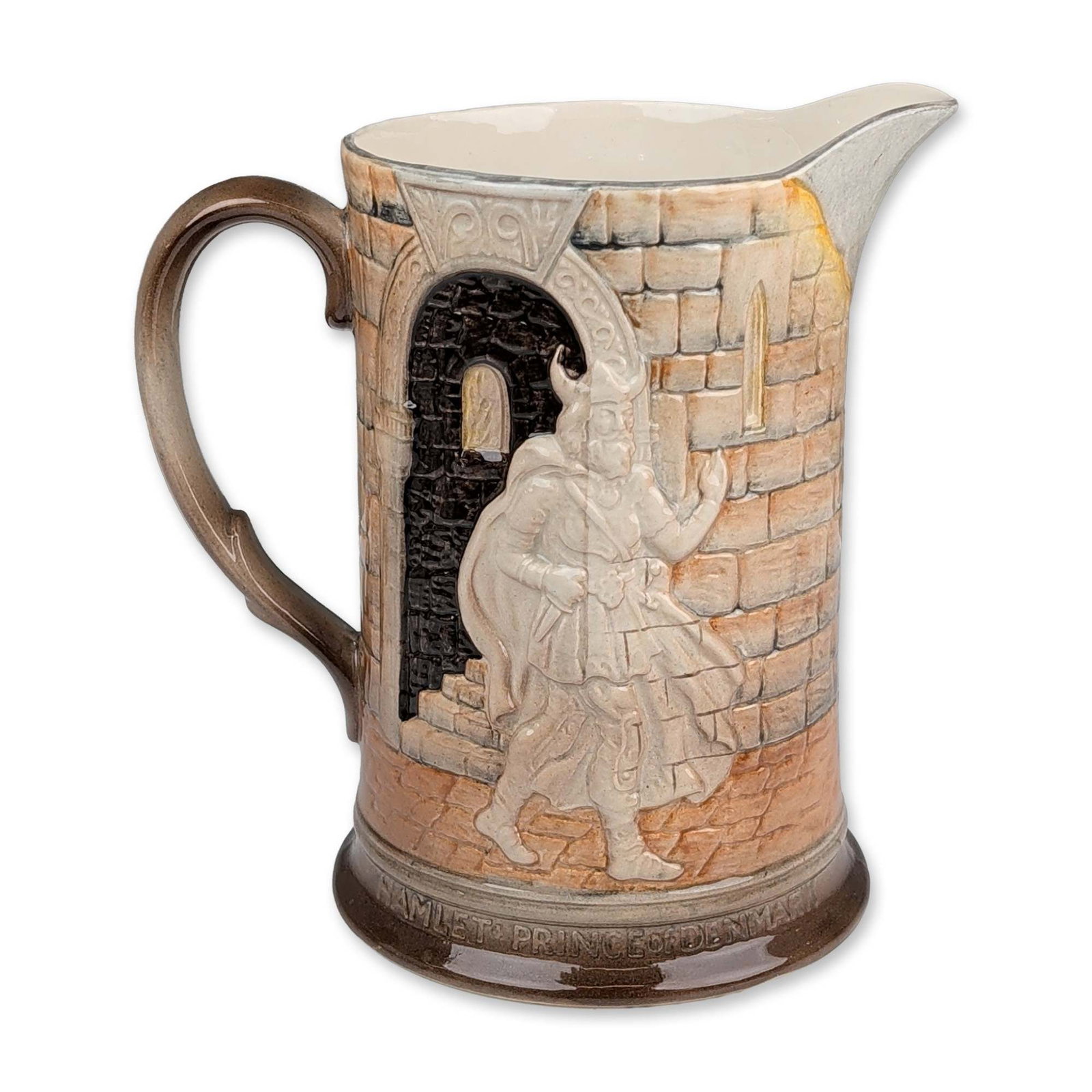 Beswick Shakespeare Ware Hamlet Pitcher: Beswick (England) earthenware pitcher, model 1146, from the Shakespeare Ware series. The vessel features relief-molded scenes from the play Hamlet within arched panels against a textured brickwork gro