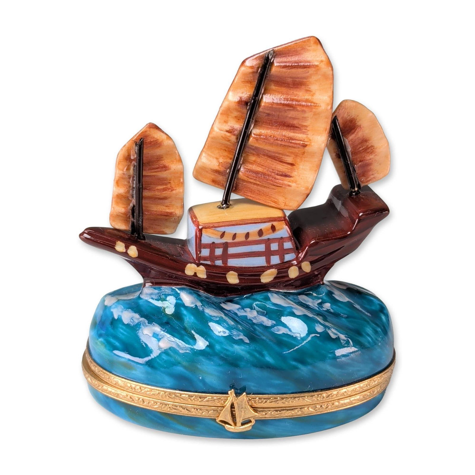 Limoges Carenton Chinese Junk Ship Porcelain Box: Limoges, France, Carenton Porcelaine hand-painted porcelain hinged trinket box modeled with a three-masted Chinese junk ship on a turbulent blue sea. The interior lid is decorated with red Chinese cal