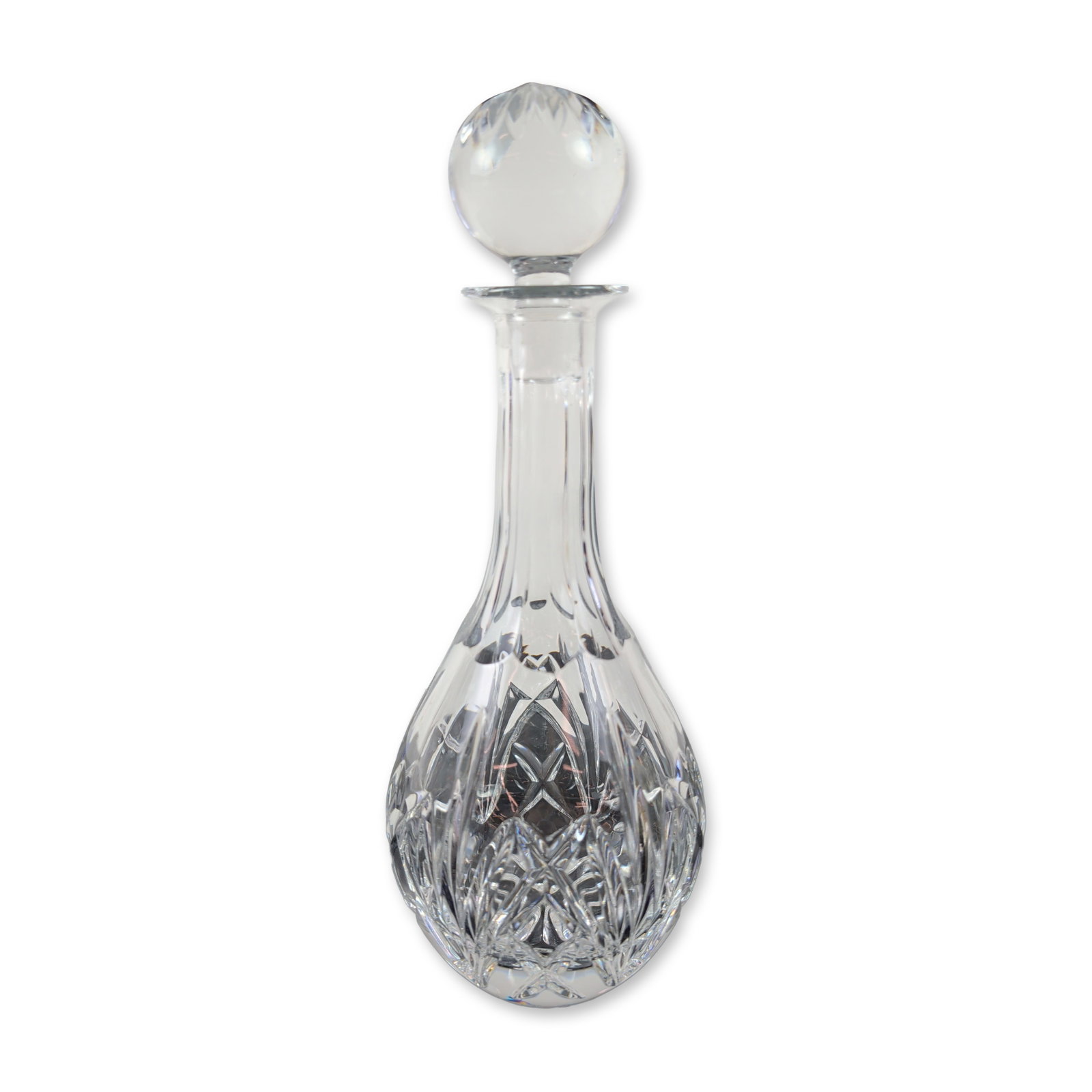 Marquis by Waterford Brookside Crystal Decanter: Marquis by Waterford. Spirit decanter in lead crystal, in the Brookside pattern. The teardrop-shaped body features deep wedge and diamond mitre cuts above a multi-point starburst base. The long, panel