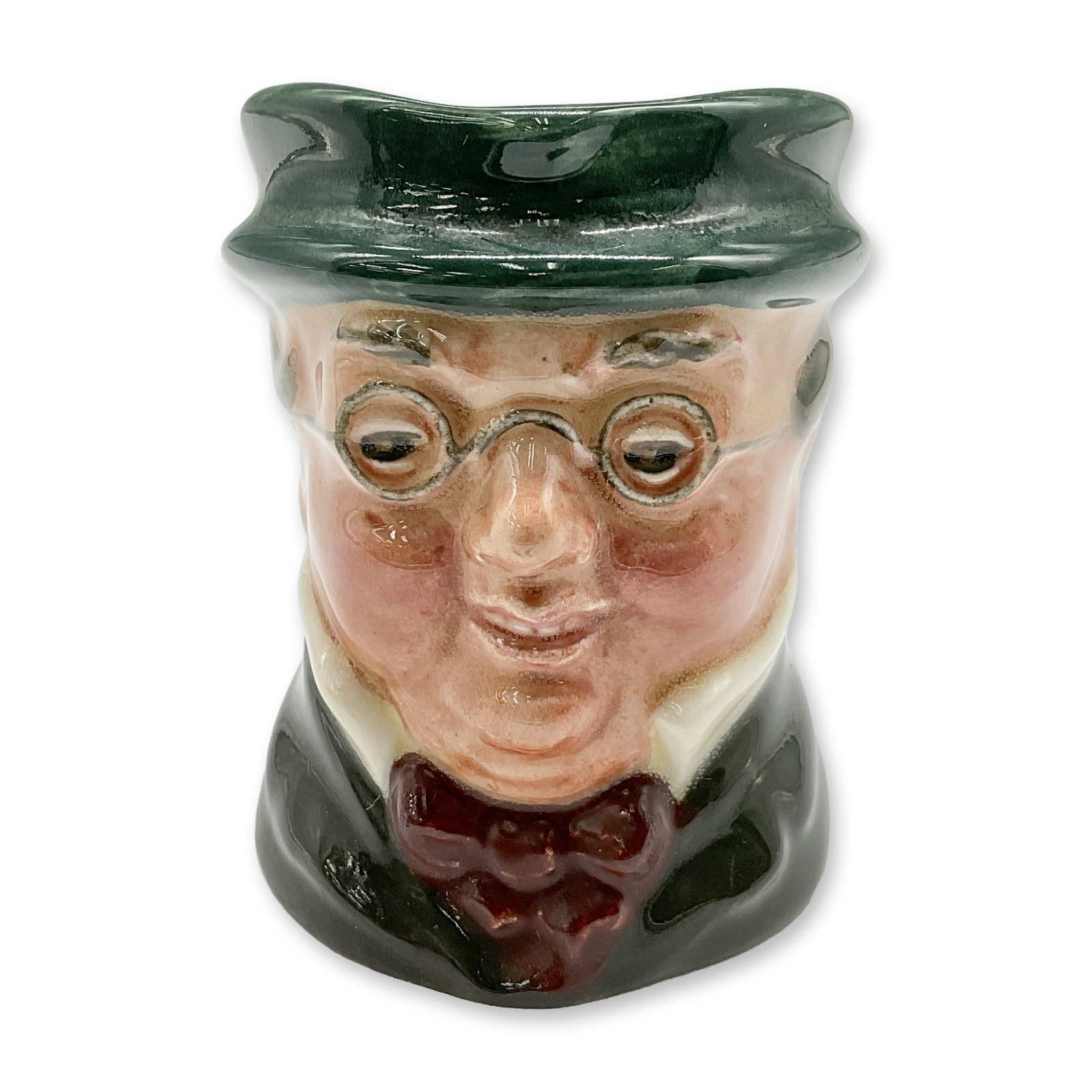 Mr Pickwick D6254 - Mini - Royal Doulton Character Jug: Style One, plain handle. Green hat and coat; maroon bow tie. Royal Doulton backstamp. Artist: Leslie Harradine and Harry Fenton Dimensions: 2.25"H Date or Era: 1947 - 1960 Manufacturer or Brand: Royal