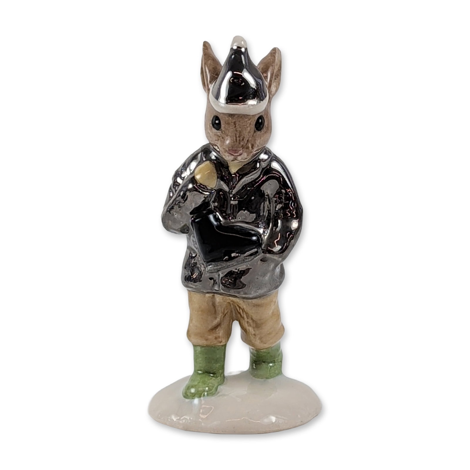 Royal Doulton Bunnykins Boy Skater Porcelain Figurine: Royal Doulton ceramic figurine titled Boy Skater, model DB 152. Glazed porcelain construction depicting an anthropomorphic rabbit character wearing a metallic silver jacket, tan trousers, and green bo