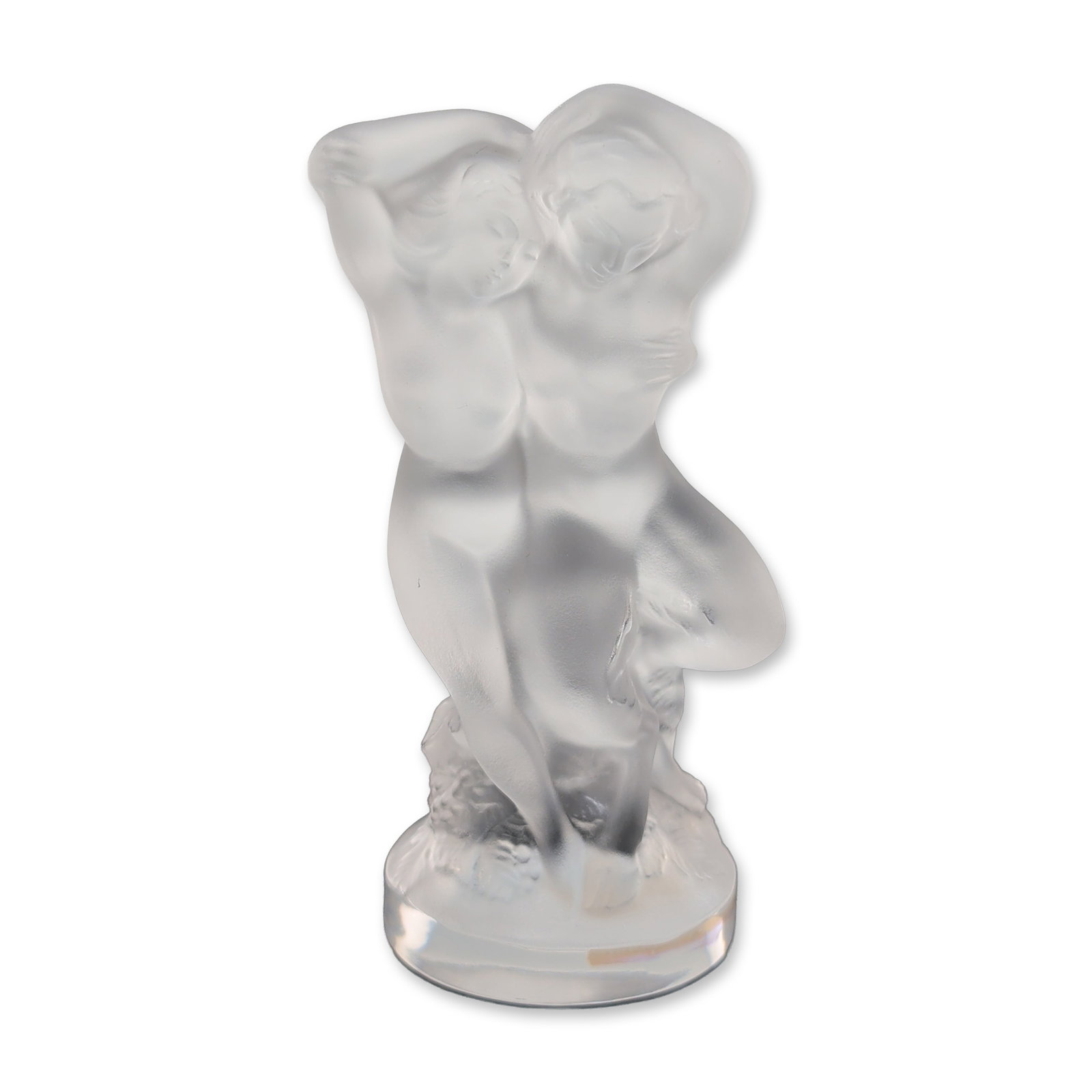 Lalique France Frosted Crystal Le Faune Figurine: Lalique France. Le Faune figurine in frosted and polished lead crystal, depicting a dancing faun and nymph in an embrace. The figures rise from a clear crystal base decorated with a high-relief grapev
