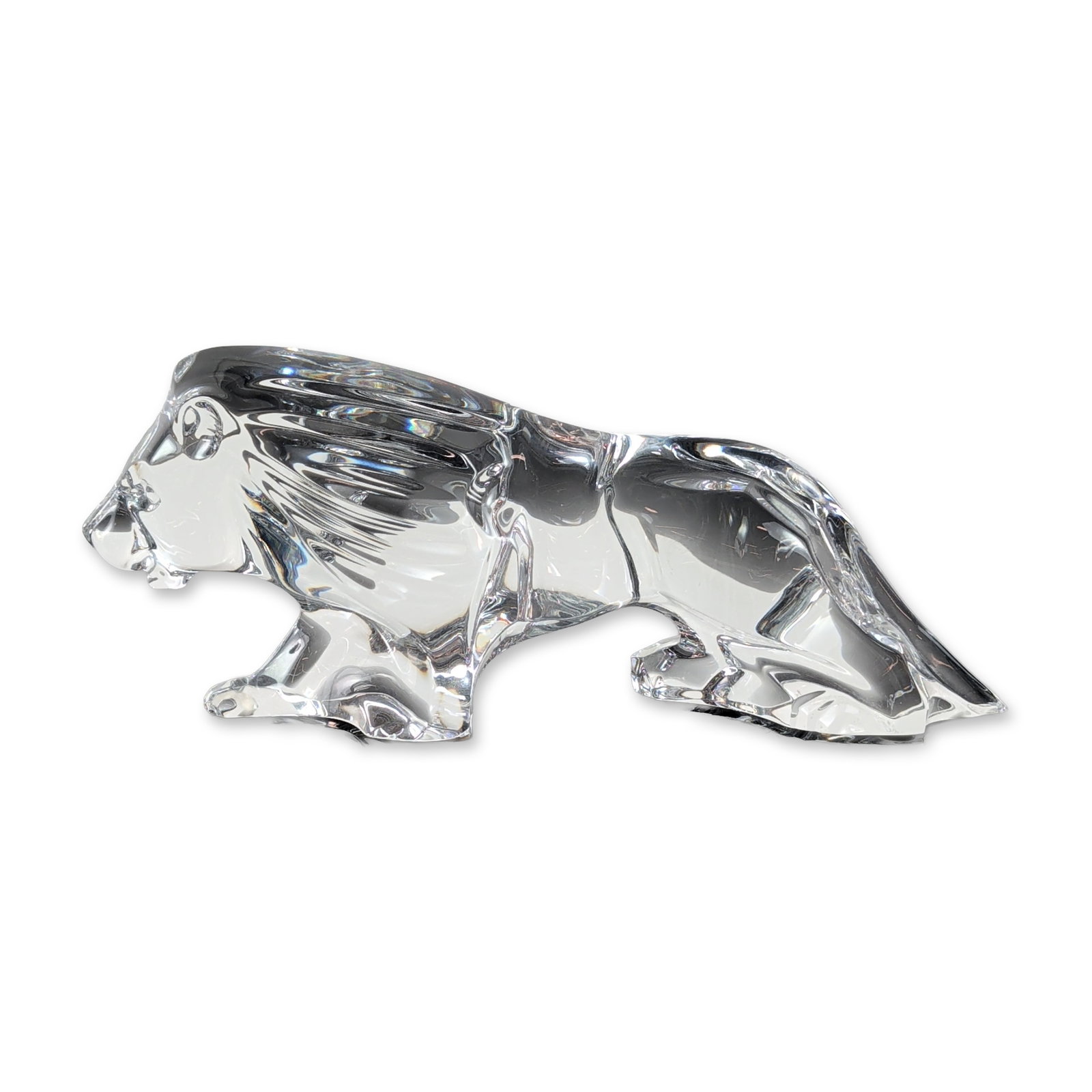 Baccarat Clear Crystal Prowling Lion Figurine: From Baccarat, France, this large abstract lion figurine is crafted in heavy clear lead crystal. The zoomorphic design showcases a stylized mane and body with blocky facets and textured surfaces. It b