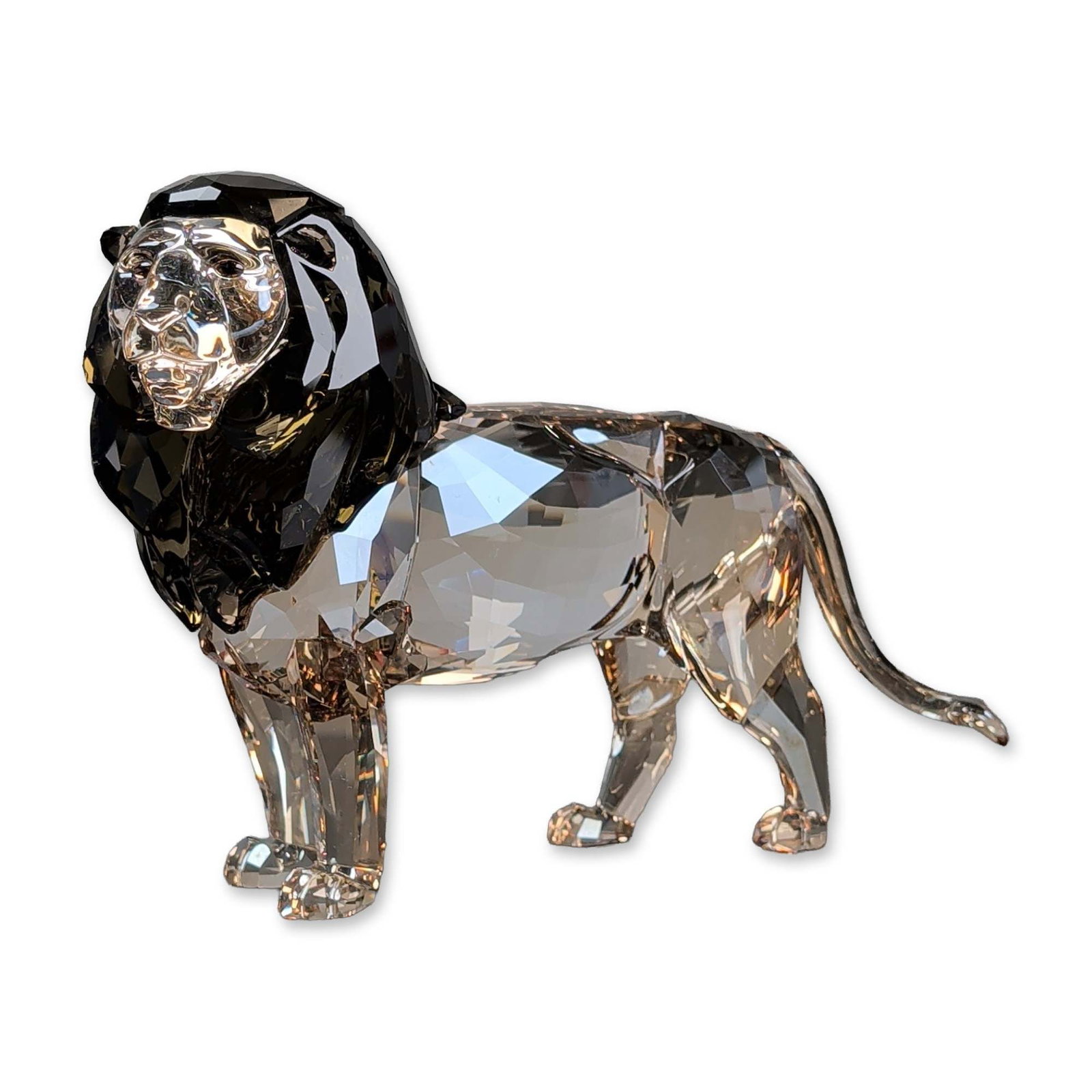 Swarovski Crystal SCS 2016 Annual Edition Figurine, Akili Lion: Swarovski. Akili lion figurine in faceted lead crystal, featuring a light body and a dark brown crystal mane. Designed by Heinz Tabertshofer for the Swarovski Crystal Society as the 2016 Annual Editio