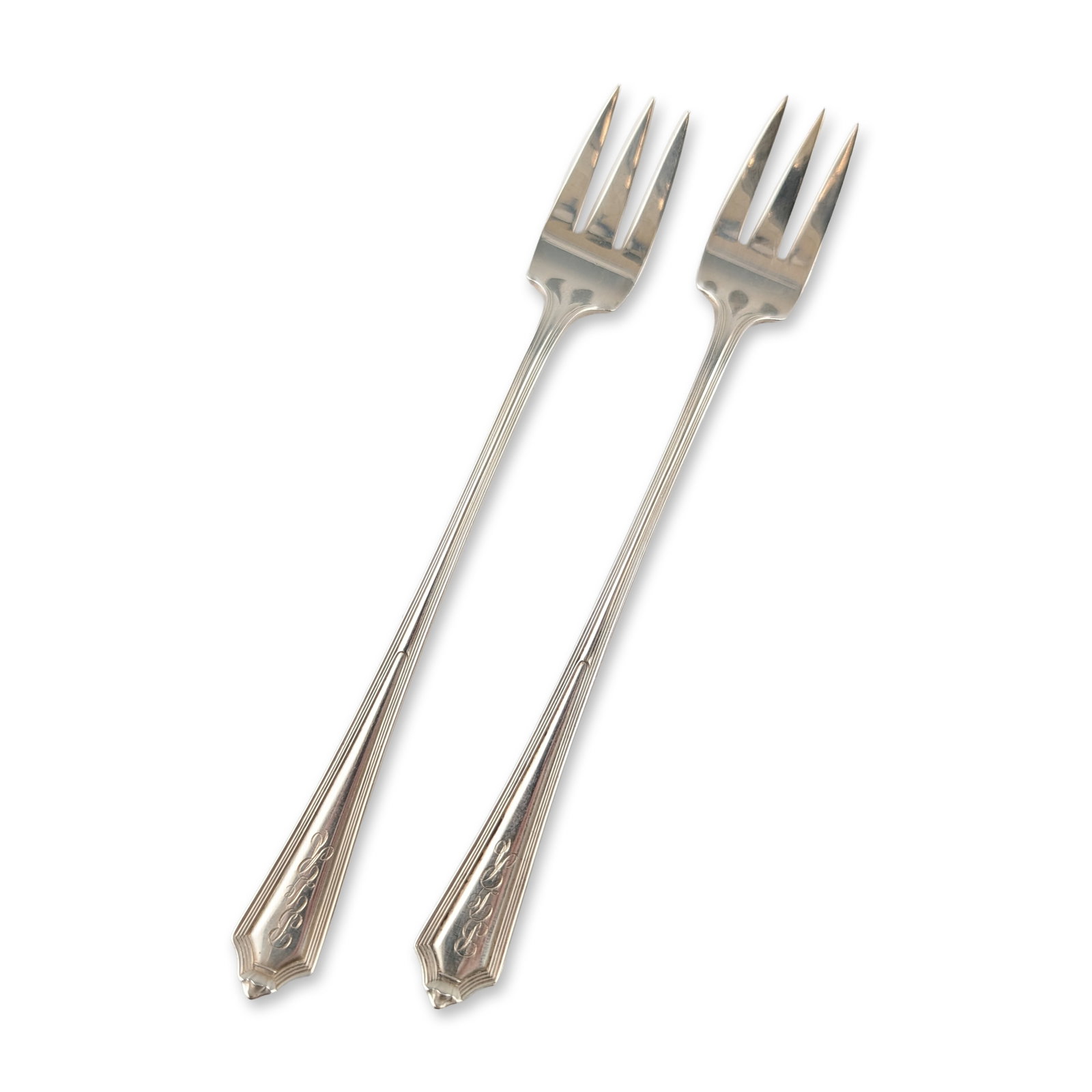 Pair of Gorham Sterling Silver Plymouth Seafood Forks: Gorham Manufacturing Company sterling silver seafood forks in the Plymouth pattern, patented in 1911. Each fork features three tines and a slender handle with parallel reeded borders terminating in a 