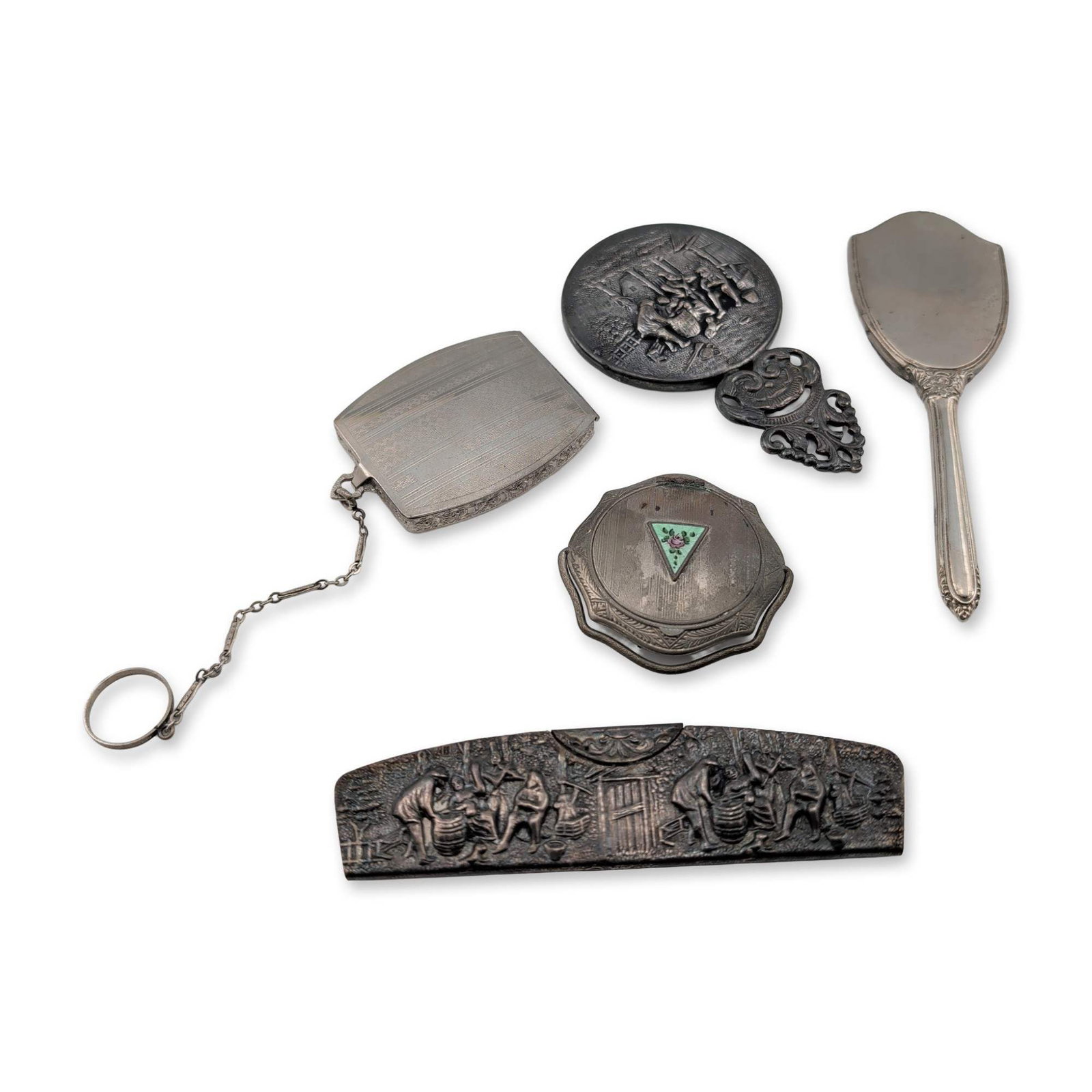 5pc Collection of Silver Toned Vanity Accessories: Collection of five vintage silver-toned vanity accessories including items of Danish origin. The group features a folding comb with a metal case embossed with a high-relief figural landscape scene, ho