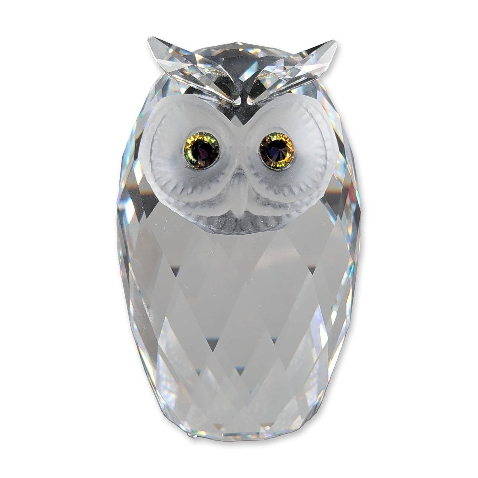 Swarovski Faceted Crystal Figurine, Giant Owl: Faceted giant owl figurine in clear lead crystal, featuring a multifaceted body and ears designed for light refraction. The facial area is detailed with frosted crystal surrounds set with dichroic