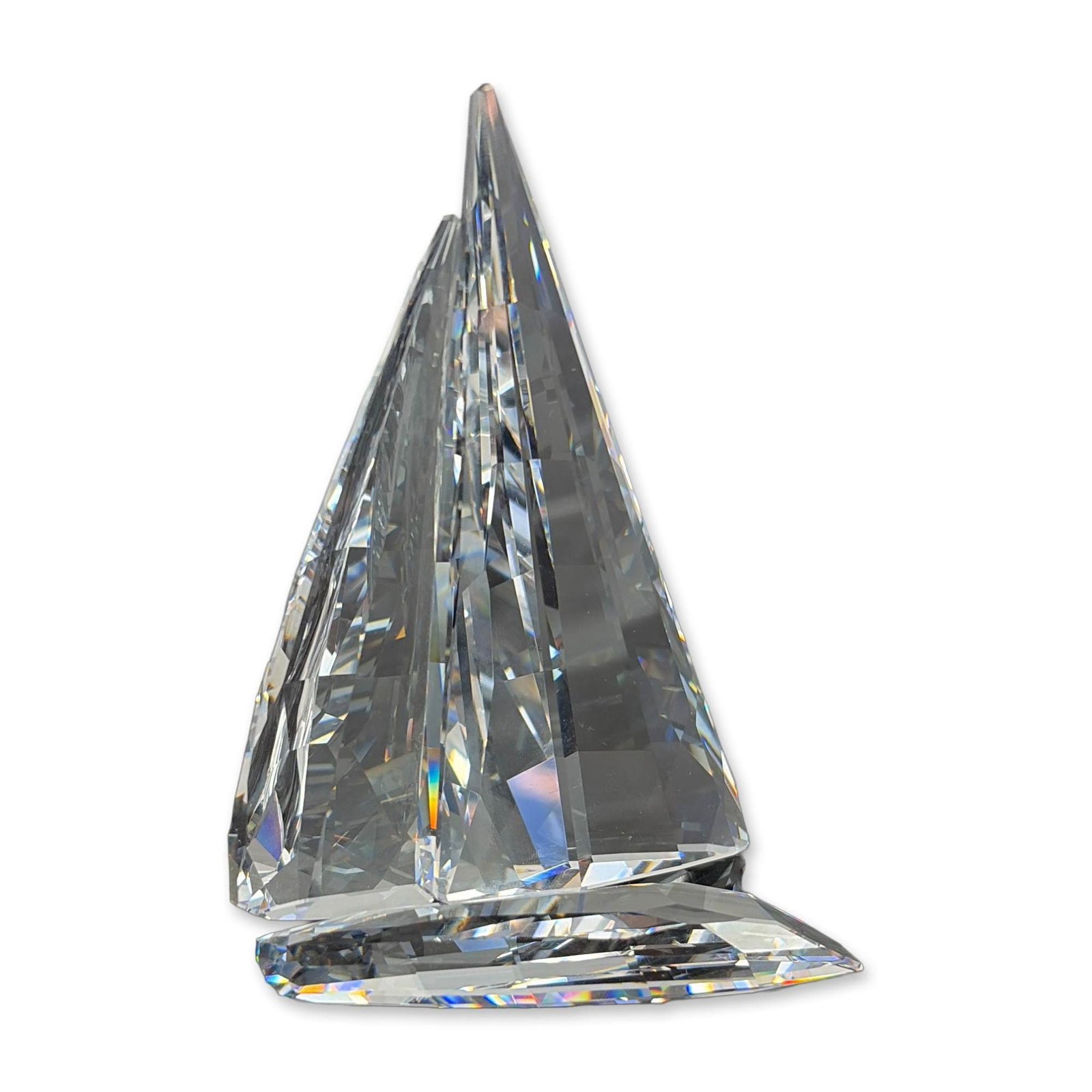 2pc Swarovski Crystal Sailing Legend Regatta Boat: Swarovski faceted clear crystal sculpture titled Sailing Legend. The piece features a stylized regatta boat form with interlocking sails and hull. Accompanied by the original blue presentation box and