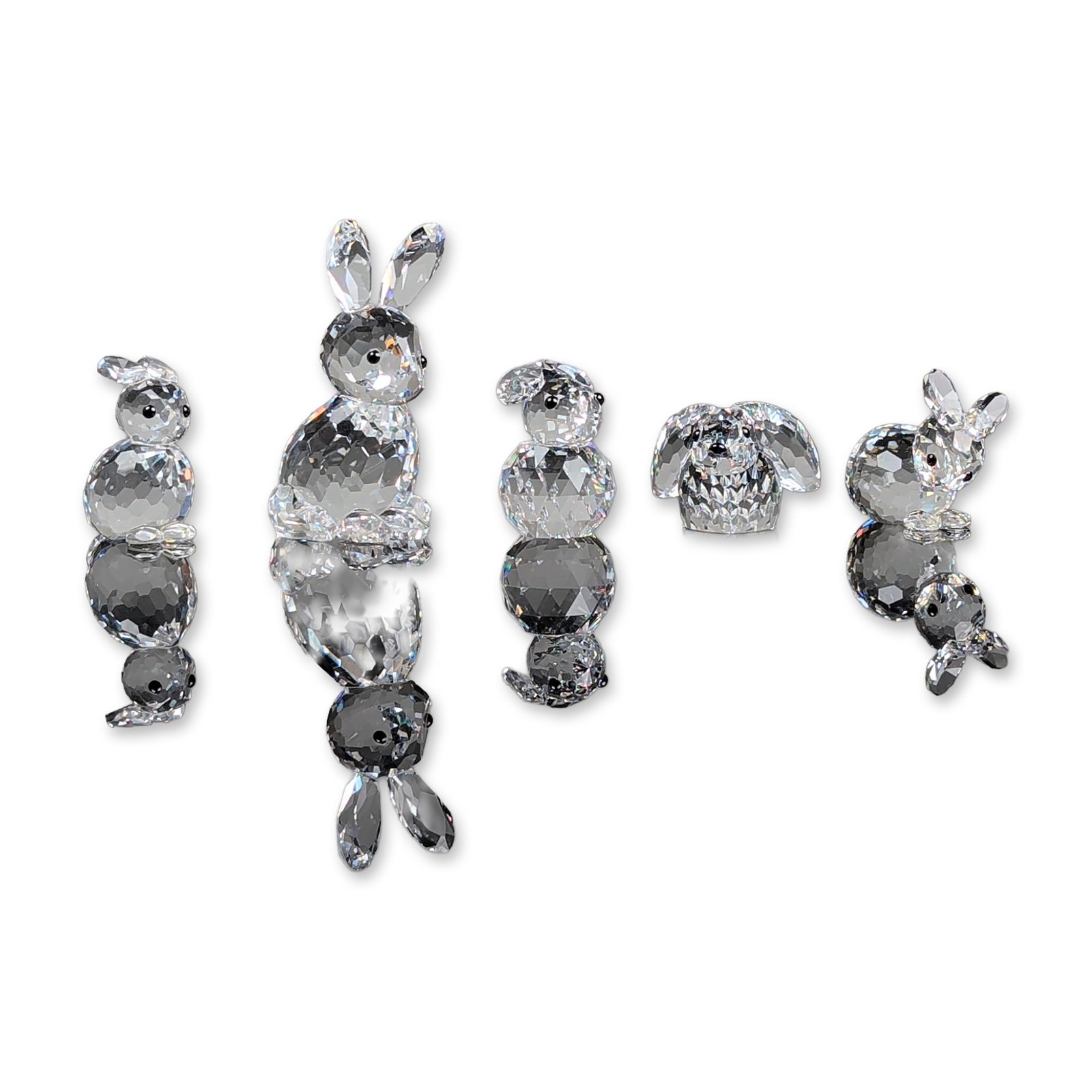 5pc Swarovski Silver Crystal Rabbit Figurines: Swarovski Silver Crystal. Collection of five rabbit figurines in faceted lead crystal, featuring five distinct models in various upright and seated poses. Each figure features faceted surfaces and ins