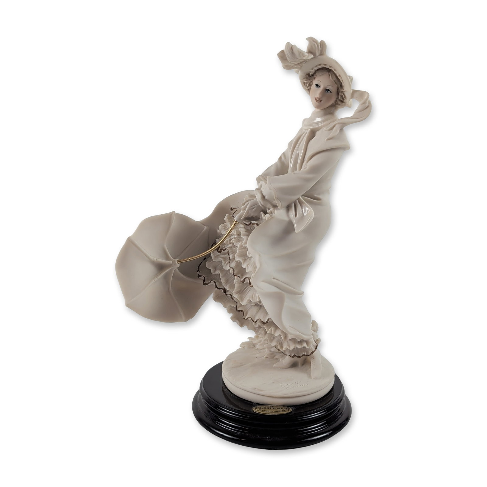 Giuseppe Armani Stormy Weather Cold-cast Porcelain Figurine: Giuseppe Armani for Florence Sculture d'Arte. Figurine titled Stormy Weather, model 0533F, depicting a woman in wind-swept late 19th-century attire. Executed in cold-cast porcelain with a matte bisque