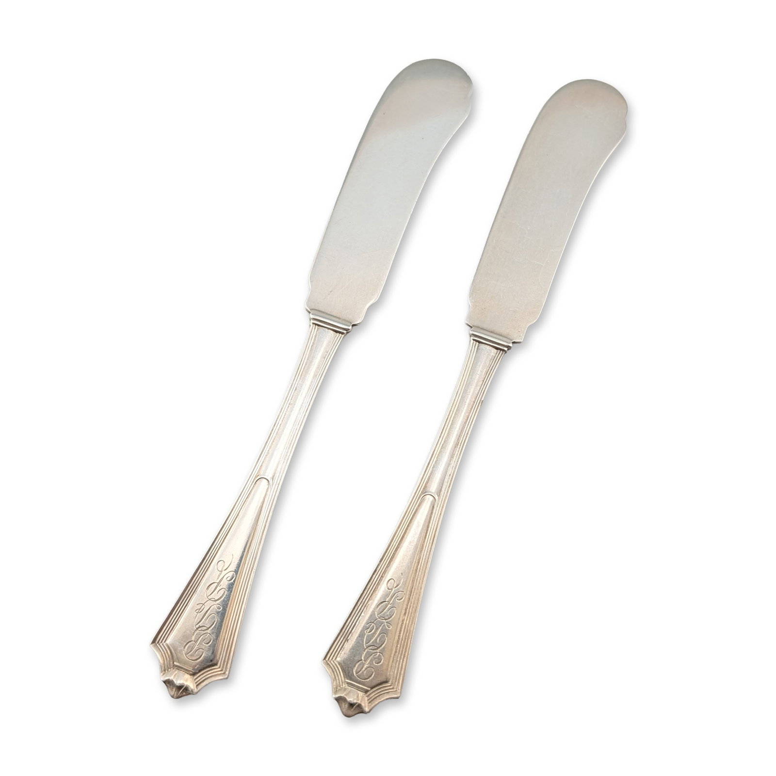 Pair of Gorham Sterling Silver Plymouth Butter Spreaders: Gorham Manufacturing Co. Pair of flat-handle butter spreaders in sterling silver, featuring the Plymouth pattern (patented 1911). Each handle exhibits Art Deco-style stepped lines with a pointed termi