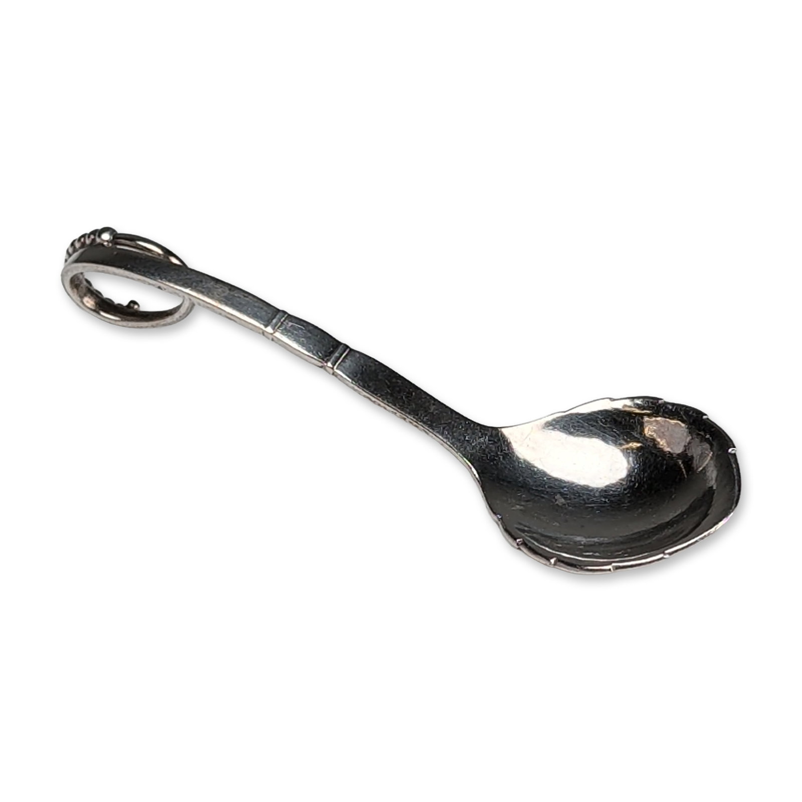 Denmark Sterling Silver Ornamental 41 Sugar Spoon: Sterling silver sugar spoon in the Ornamental pattern, model number 41. The piece features a shell-shaped bowl and a curved handle terminating in a beaded loop. G hallmarked over Sterling Denmark, 925