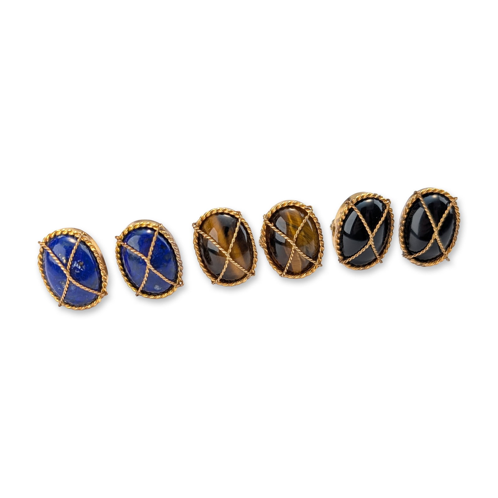 3 Pairs of Gold-Plated Oval Cabochon Cufflinks: Three pairs of gold-plated cufflinks, each featuring large oval cabochons appearing to be lapiz lazuli, tiger's eye and onyx. Each stone is bordered and crisscrossed with a rope-like design. Tested