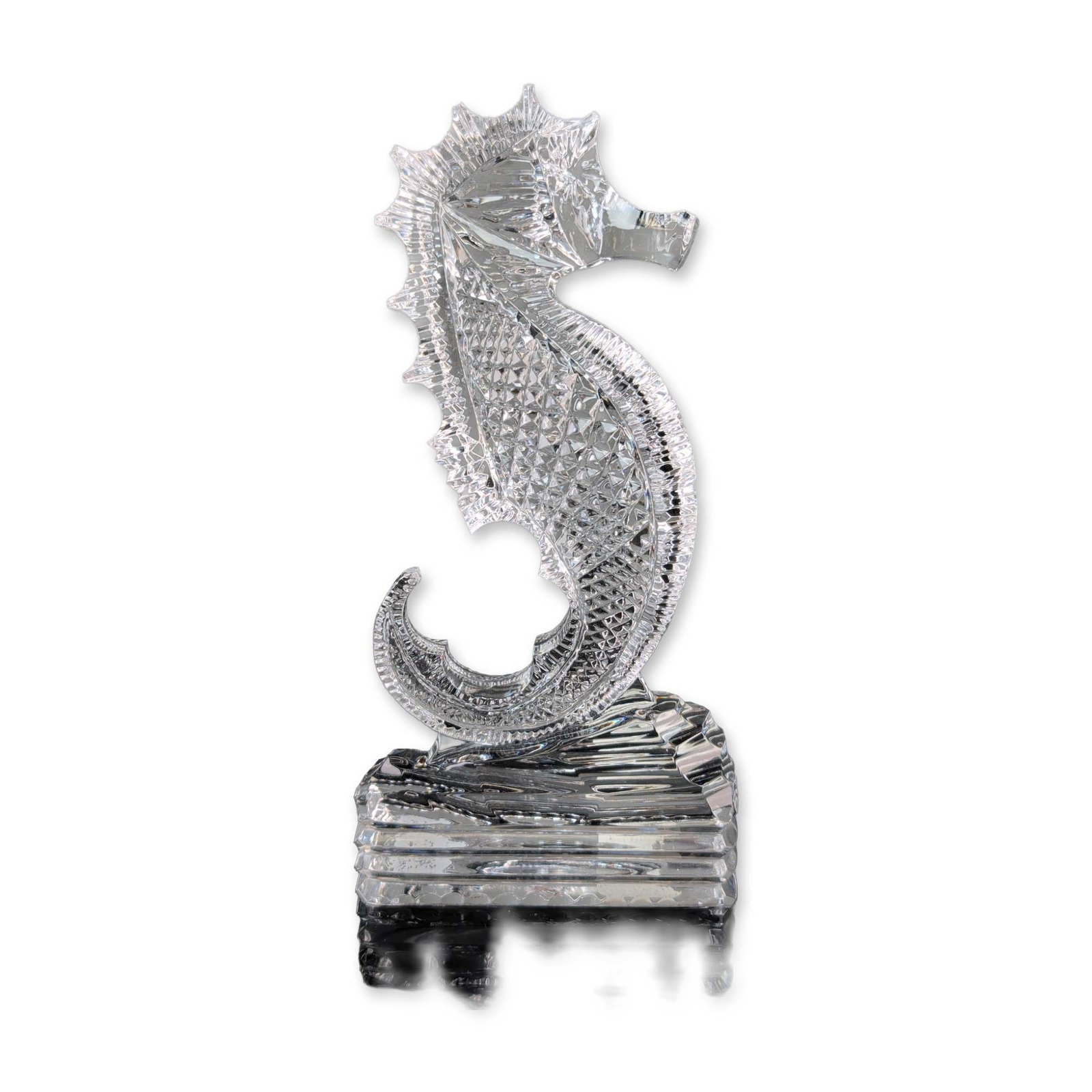 Waterford Crystal Small Seahorse Figurine: Waterford Crystal. Small Seahorse sculpture in cut lead crystal, featuring a textured body with diamond and wedge patterns. The upright figure is mounted to a multi-tiered rectangular base. Includes m