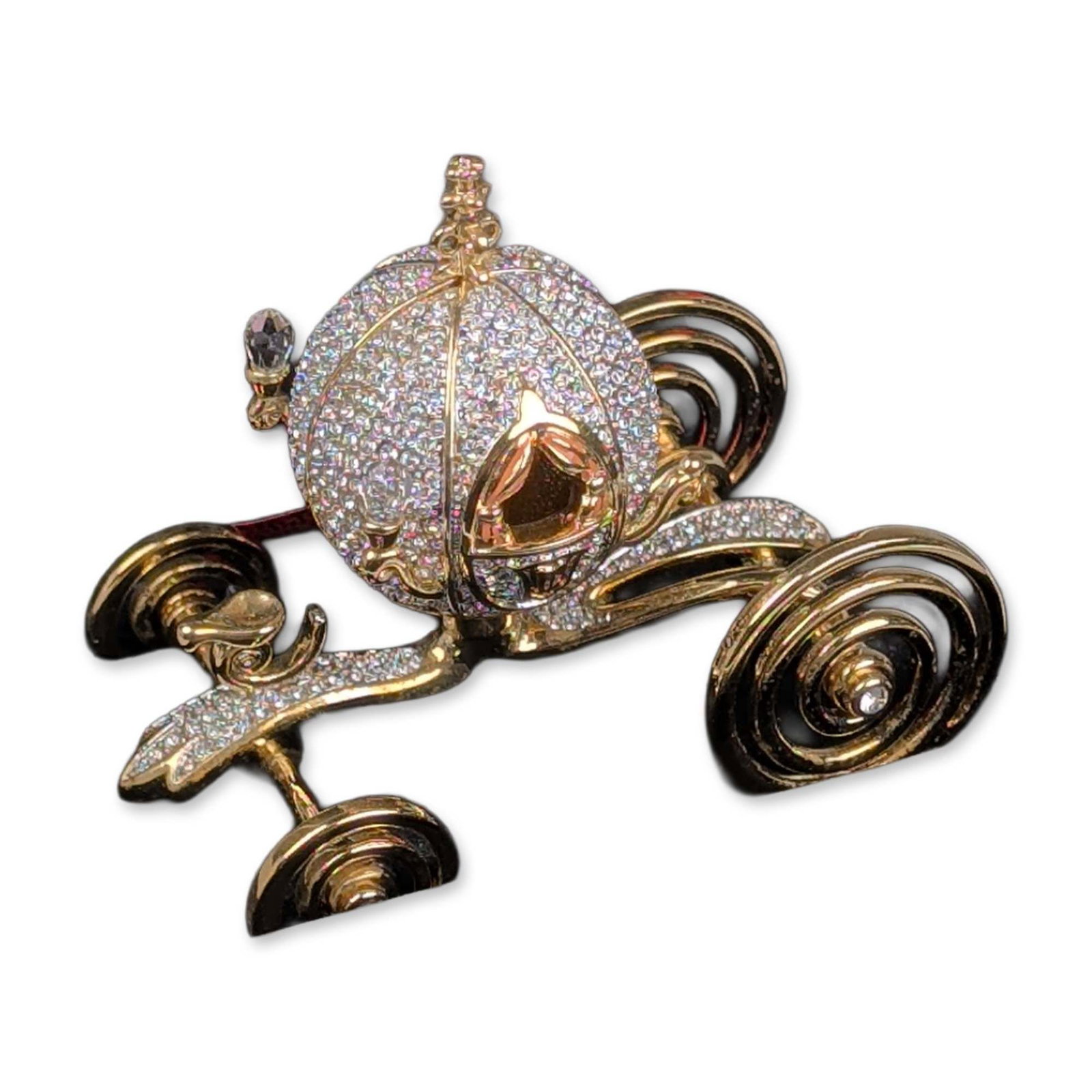 Arribas Bros Disney Crystal Jeweled Cinderella's Coach: The Cinderella pumpkin coach is part of the Signature Series. Designed in gold-plated metal and handset clear pave crystals. Features include spiral-form wheels with central crystal accents, scrollwor