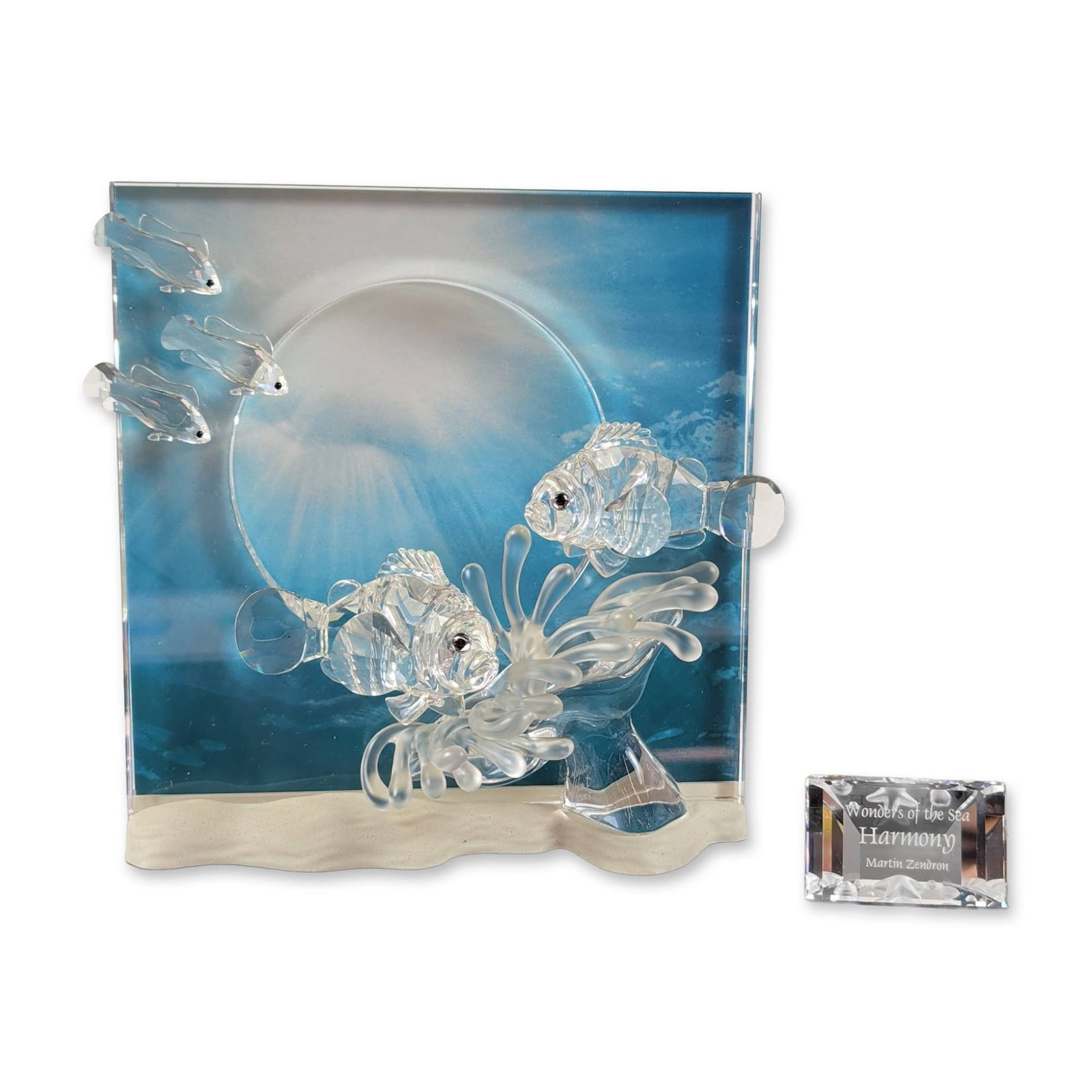 Swarovski Wonders of the Sea Harmony Crystal Sculpture: Swarovski 2005 Annual Edition, the first issue in the Wonders of the Sea trilogy titled Harmony. SCS faceted and molded lead crystal sculpture featuring two clownfish set among frosted sea anemone ten