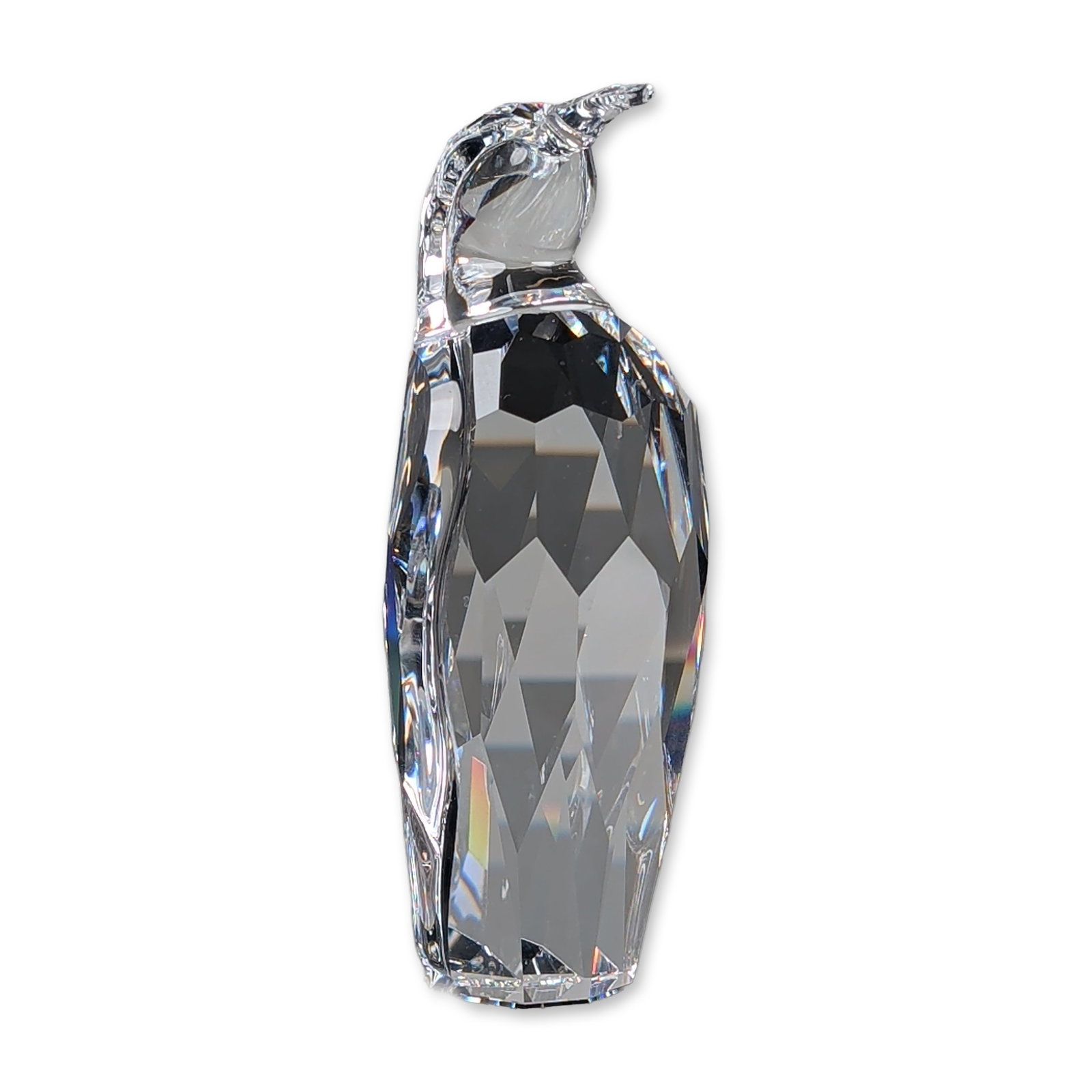 Swarovski Crystal 1996 SCS Annual Edition Figurine, Penguin Father: SCS1996 Annual Edition figurine Crystal Classics series. Faceted clear crystal construction featuring a long, pointed beak and streamlined form. Acid-etched Swarovski swan mark to the underside. Accom