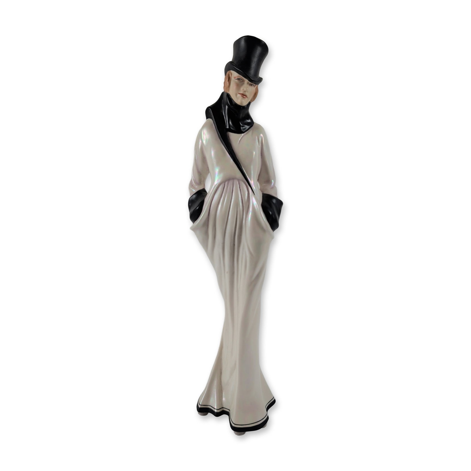 Michael Sutty Art Deco Lady Porcelain Figurine: Michael Sutty, England. An Art Deco-style figurine crafted in hand-painted porcelain, portraying a female figure in elegantly stylized masculine formalwear. She wears a tall black top hat, a high-coll
