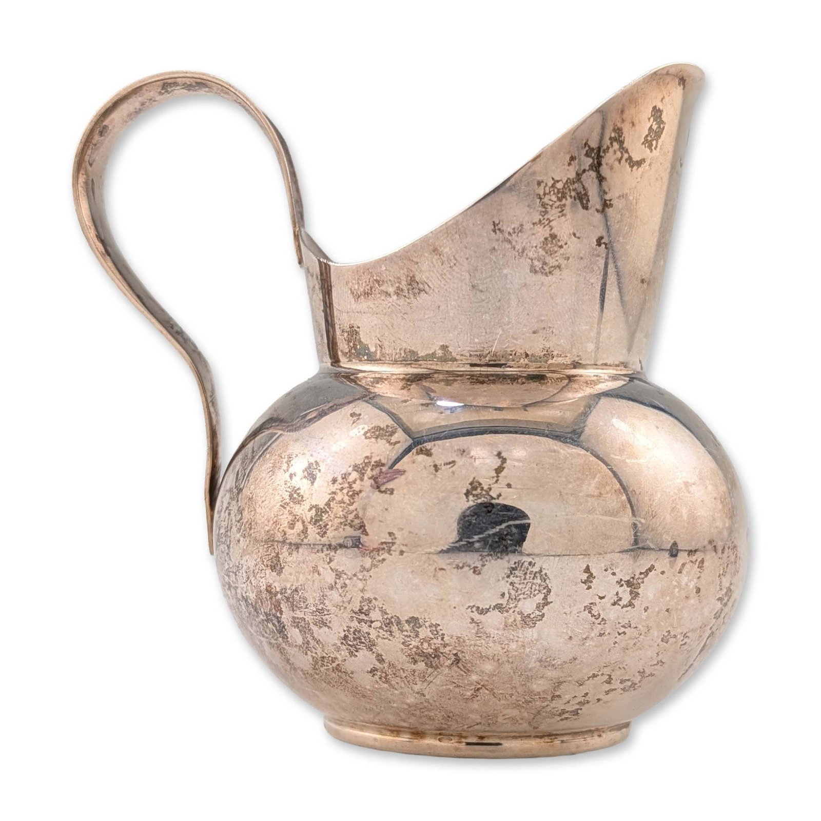 Gorham Sterling Silver Creamer: A bulbous creamer with a looped handle crafted from sterling silver. Marked Gorham Sterling 773 to the underside. Dimensions: 3.5"W x 3.5"H Manufacturer or Brand: Gorham Country of Origin: United Stat