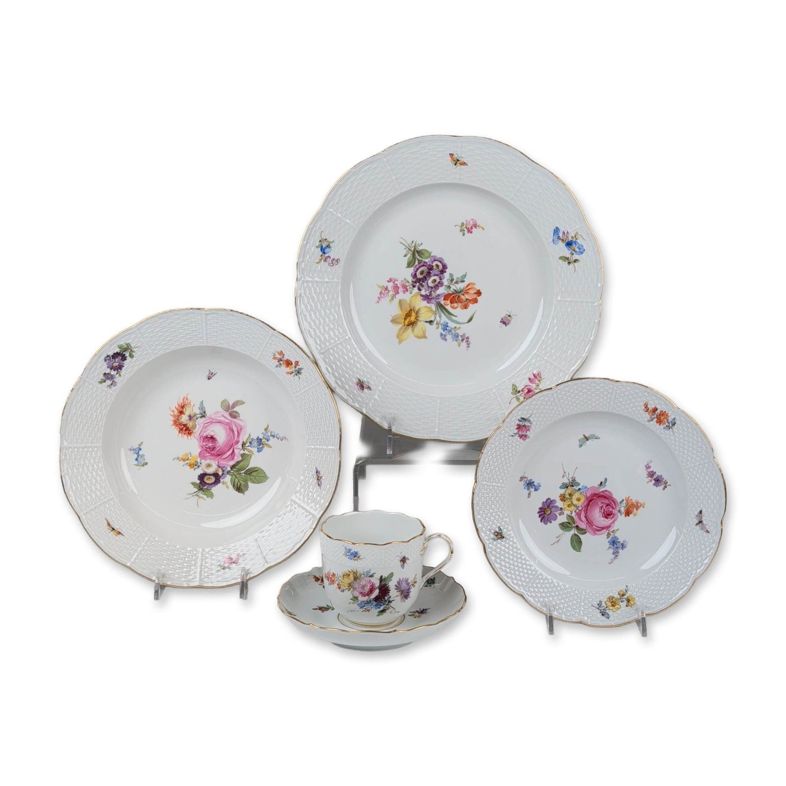 5pc Meissen Floral Porcelain Service Group: A five-piece Meissen hard-paste porcelain service group in the Deutsche Blumen pattern features hand-painted polychrome floral bouquets and scattered insect motifs. The dinner plate, rimmed soup bowl,