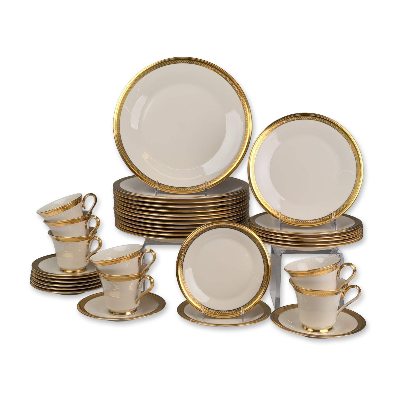 35pc Lenox Gilt Porcelain Dinner Service: Dinner service in the Aristocrat pattern, crafted in ivory fine porcelain featuring a wide gold-encrusted border. The gilded decoration consists of an acid-etched geometric pattern with repeating scro