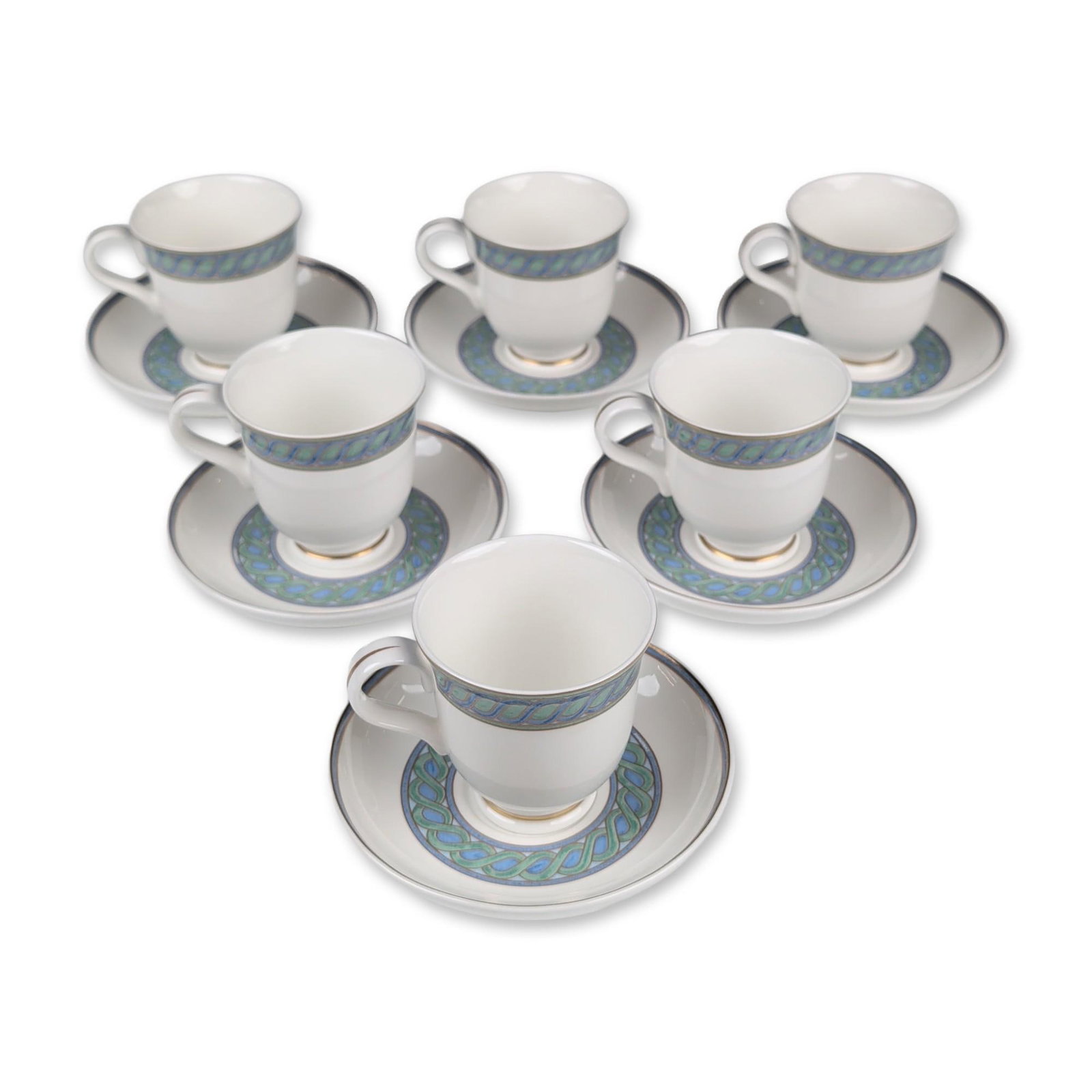 12pc Christofle Torsada Porcelain Demitasse Cups and Saucers: A set of six demitasse cups and six saucers in fine white porcelain that features the Torsada pattern, displaying a continuous braided cable motif in teal-blue and green tones, finished with gilt rims