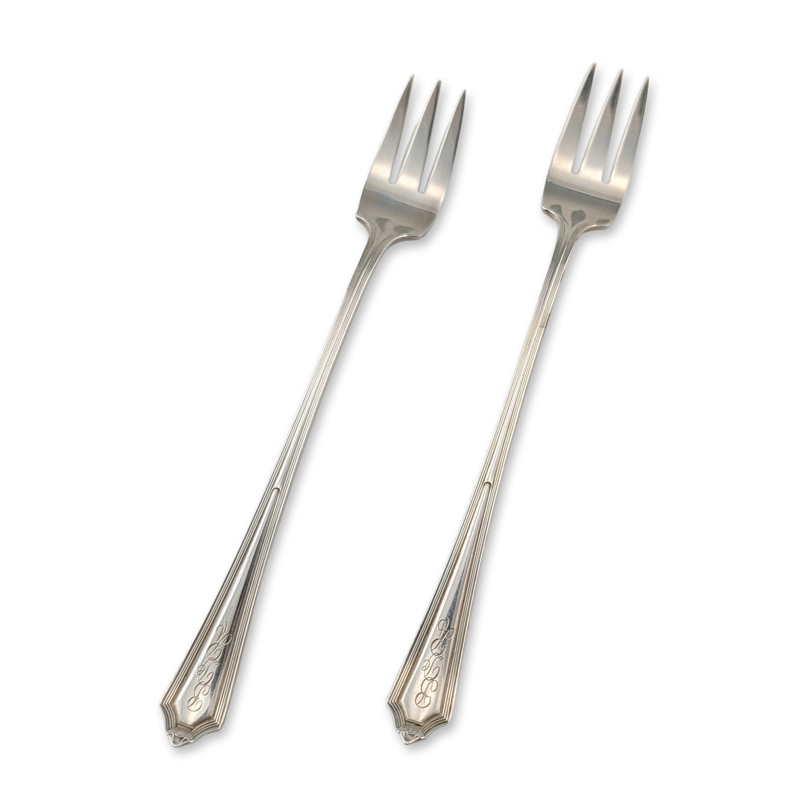 Pair of Gorham Plymouth Sterling Silver Cocktail Forks: Pair of cocktail or pickle forks by Gorham Manufacturing Company in the Plymouth pattern. Solid sterling silver construction in the Art Deco style, featuring three-tine heads and tapered handles with 