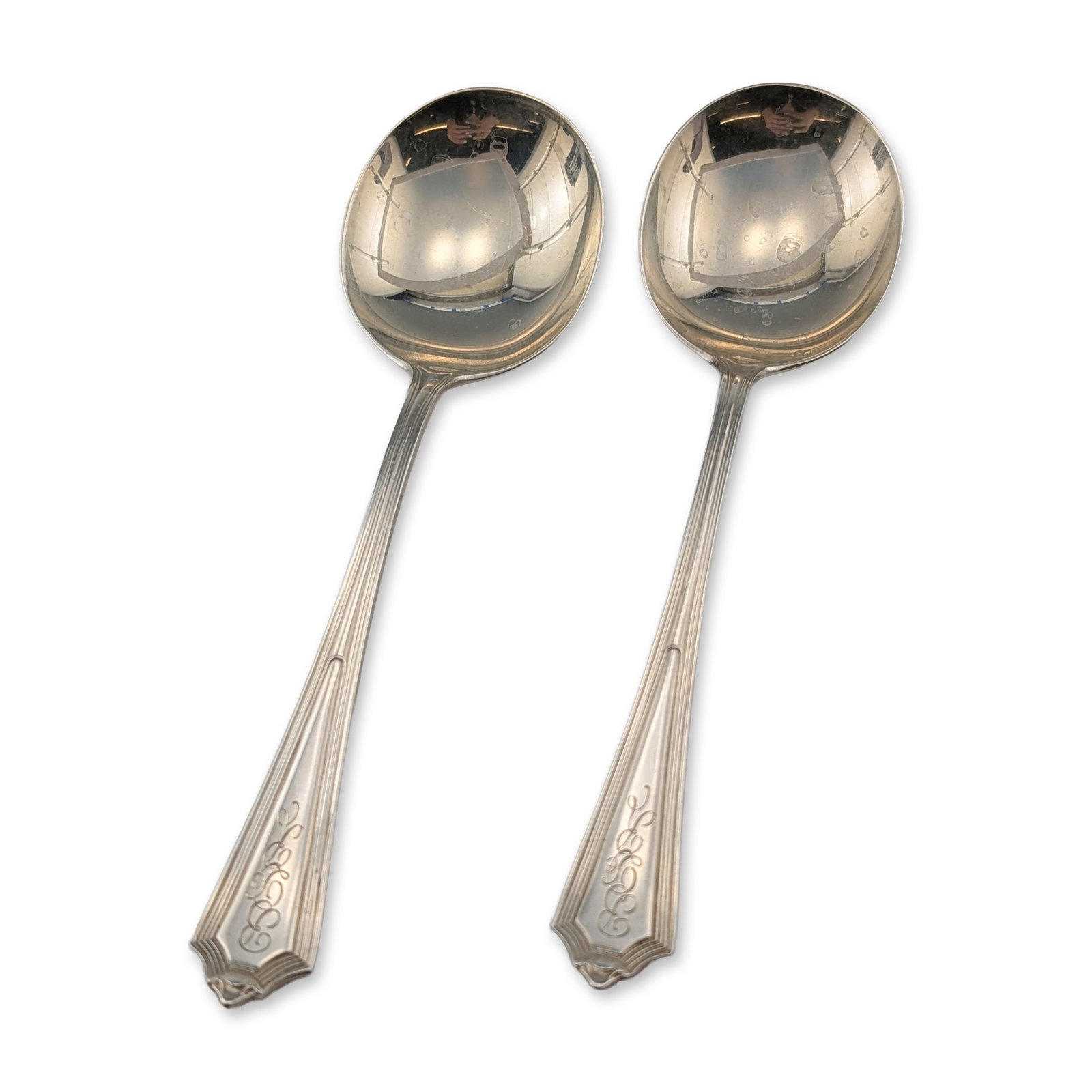 2pc Gorham Plymouth Pattern Sterling Silver Bouillon Spoons: Gorham Manufacturing Company. Pair of bouillon spoons in the Plymouth pattern, sterling silver, featuring an architectural design with stepped borders and pointed terminals. Each handle is engraved wi
