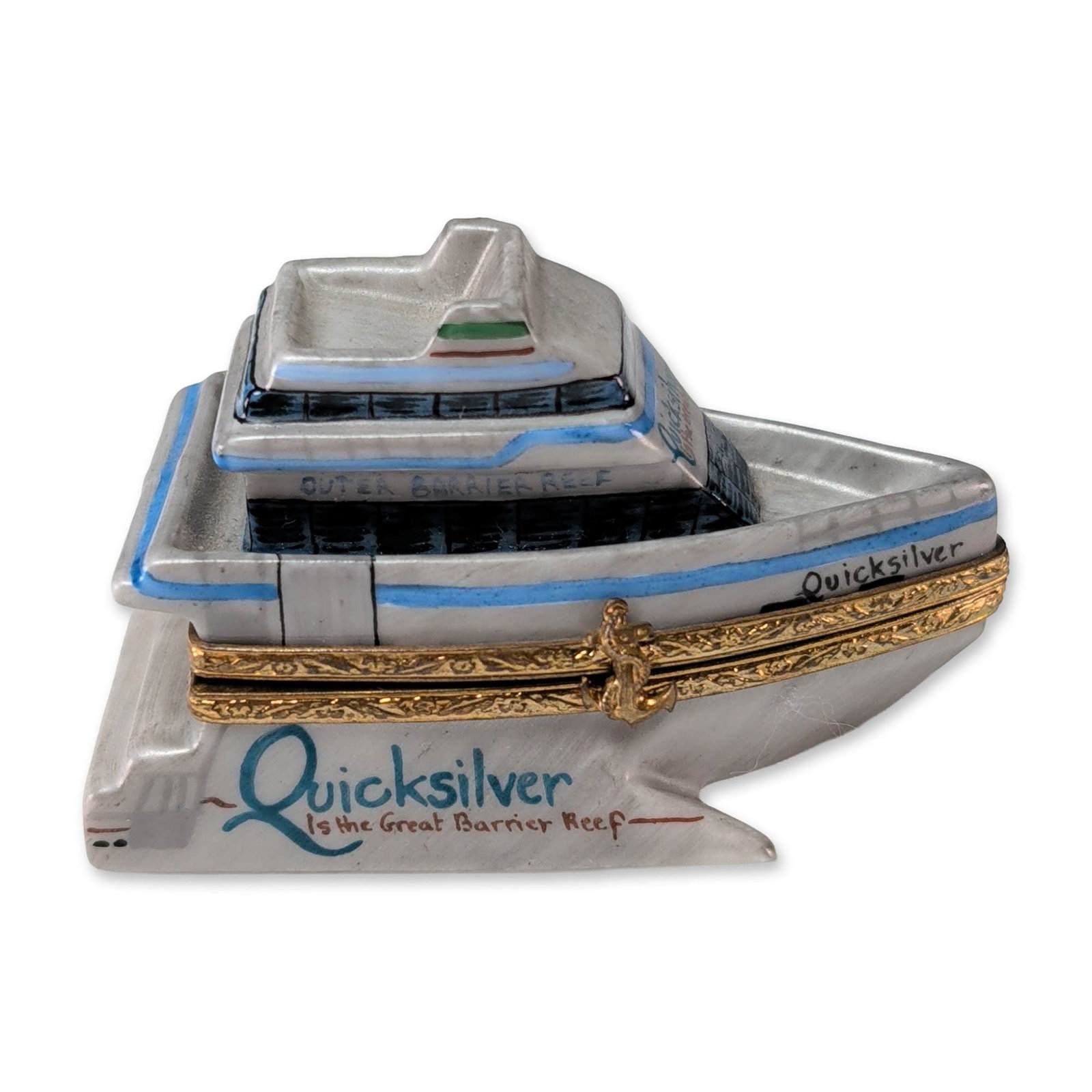 Limoges France Hand Painted Porcelain Quicksilver Catamaran Trinket Box: Limoges France hinged porcelain trinket box modeled as a Quicksilver catamaran cruise ship on an integrated base. The piece features hand-painted overglaze decoration with architectural details in blu