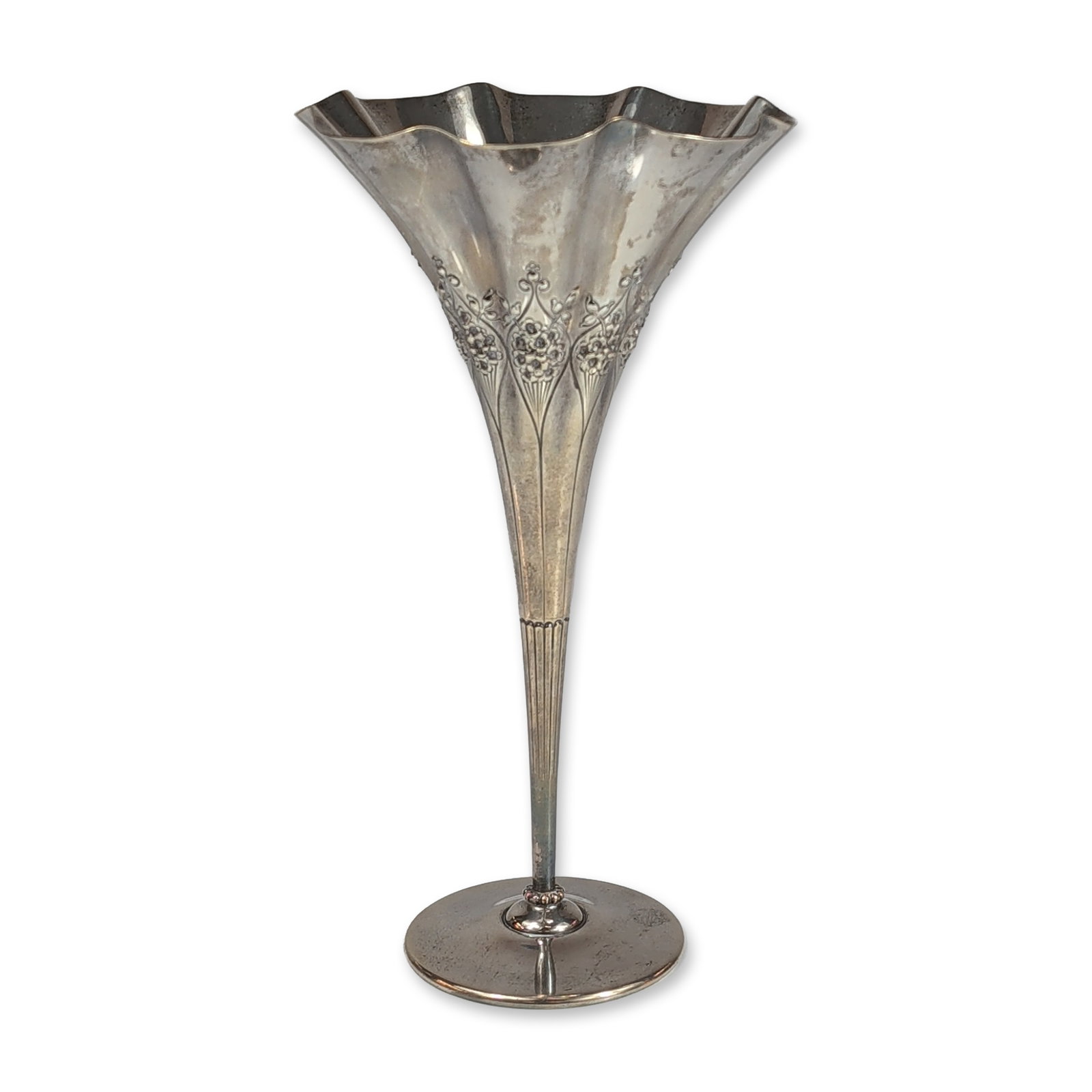Tiffany & Co. Weighted Sterling Silver Trumpet Vase: Tiffany & Co. Art Nouveau trumpet vase in sterling silver, featuring repousse and chased floral motifs with stylized stems extending toward a flared, ruffled rim. The slender body terminates in a circ